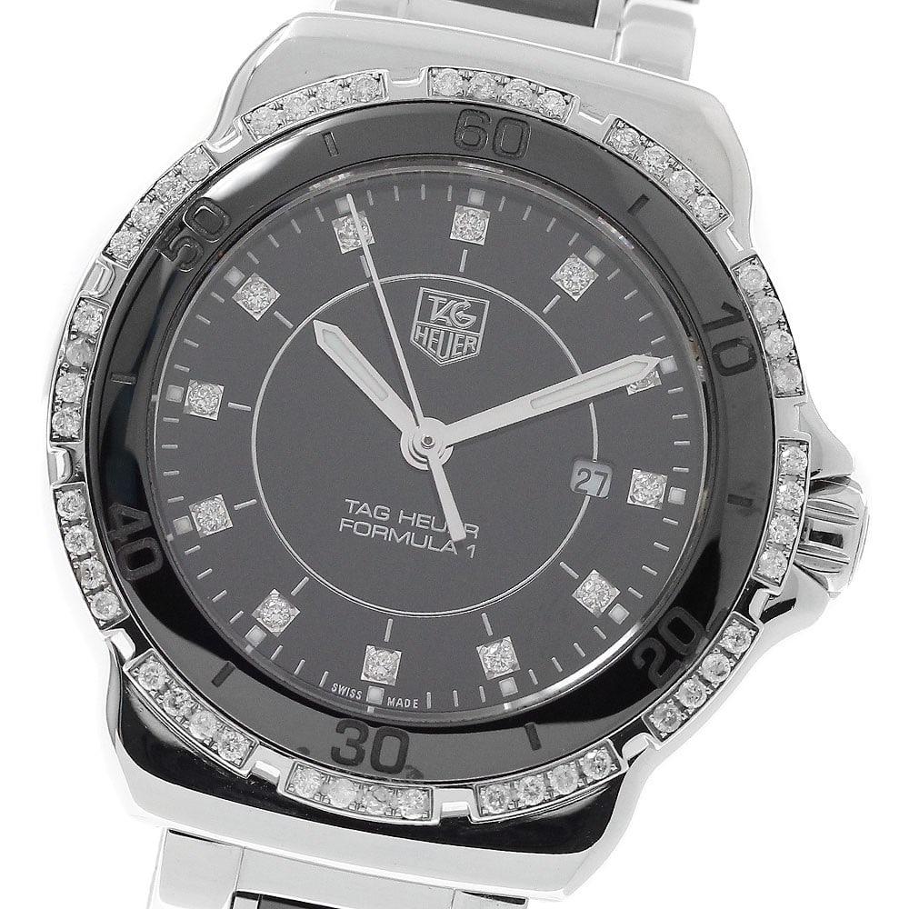 TAG Heuer Formula 1 quartz ladies watch diamond bezel WAH1312: TAG Heuer Formula 1 quartz ladies watch diamond bezel WAH1312 This TAG Heuer Formula 1 women's wristwatch (model WAH1312) features a stainless steel and ceramic case and band with a black dial. The be