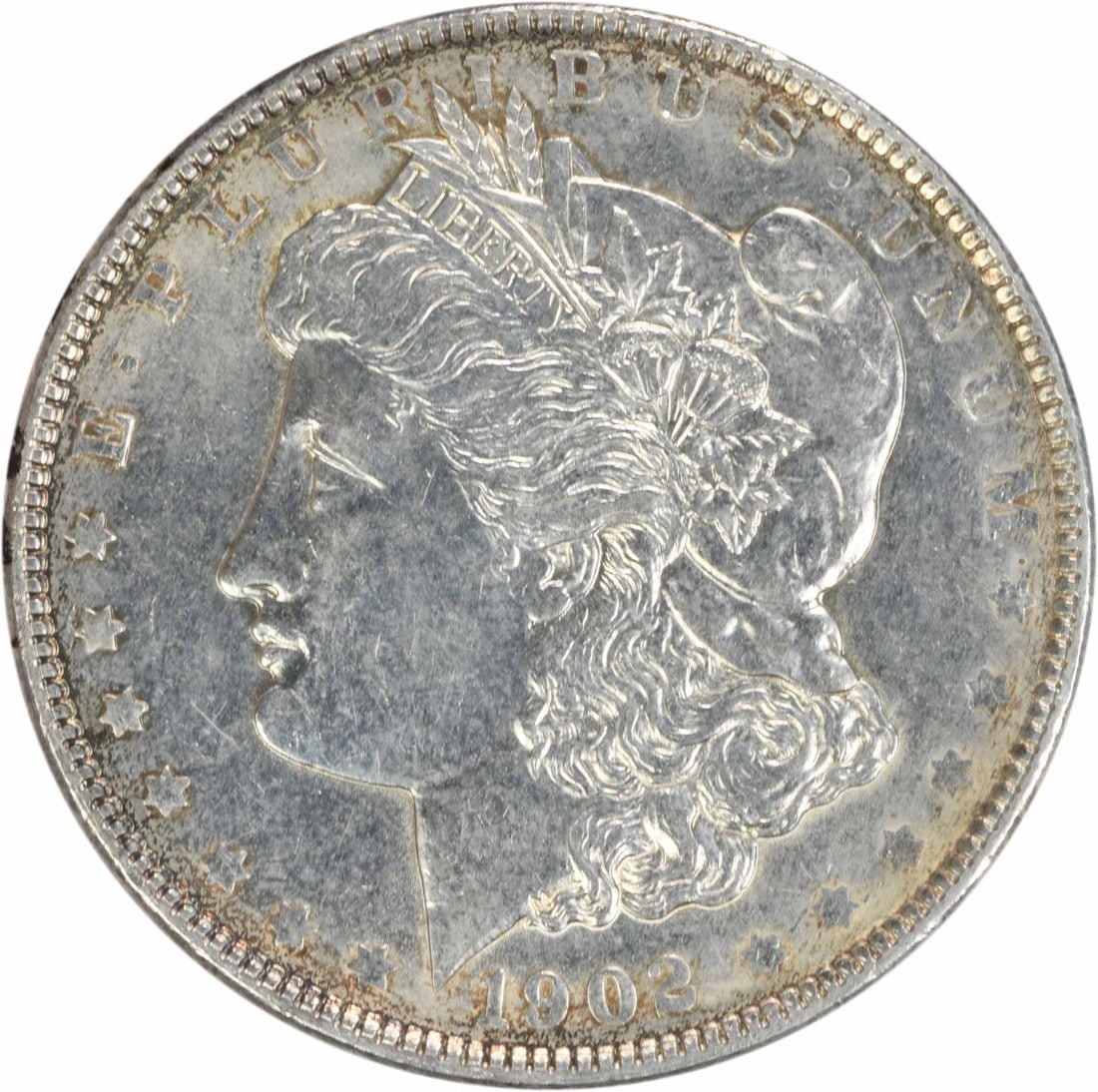 1902 Morgan Silver Dollar AU Uncertified 90% Silver Coin: 1902 Morgan Silver Dollar AU Uncertified 90% Silver Coin This 1902 Morgan Silver Dollar is a beautiful example of classic American coinage, featuring the renowned design by George T. Morgan. The coin 