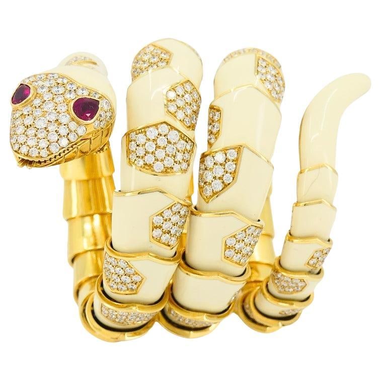 Bvlgari Serpenti 18k Gold Enamel Watch with Diamonds and Ruby Eyes: Bvlgari Serpenti 18k Gold Enamel Watch with Diamonds and Ruby Eyes Rare Bulgari Serpenti wrist watch in a coiled serpent design, made in Italy circa 1970. The watch features an 18k yellow gold case an