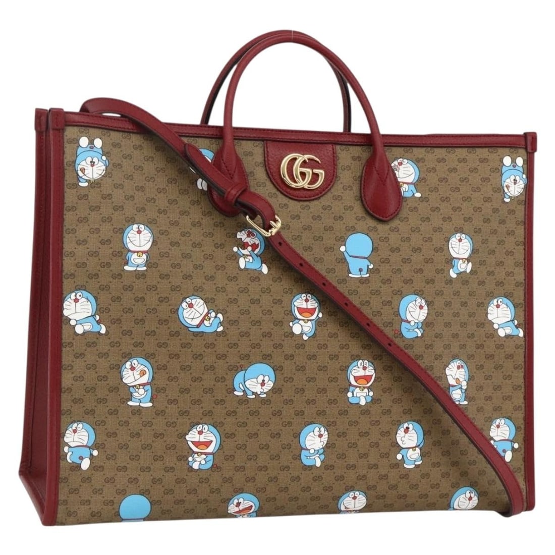 Gucci Doraemon Micro GG Supreme Beige PVC Two Way Tote Bag with Strap: Gucci Doraemon Micro GG Supreme Beige PVC Two Way Tote Bag with Strap This GUCCI x Doraemon Micro GG Supreme 2-way tote bag is crafted in beige PVC leather with Micro Small GG canvas detailing. Featur