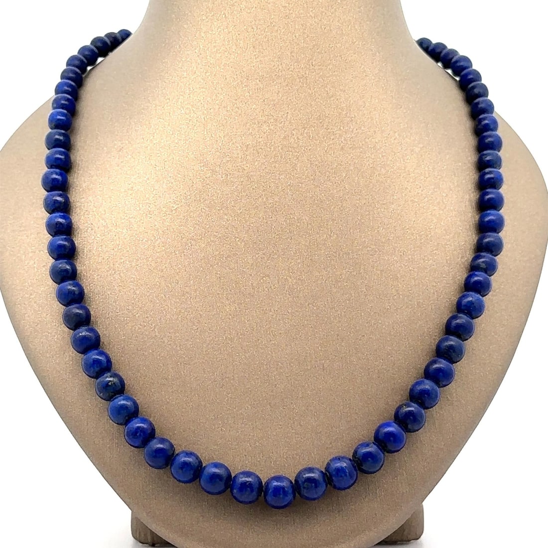 Vintage Lapis Lazuli Bead Necklace 24 Inch White Gold Clasp: Vintage Lapis Lazuli Bead Necklace 24 Inch White Gold Clasp This stunning vintage necklace features graduated beads of natural lapis lazuli, showcasing a vivid blue color. The round beads range from a