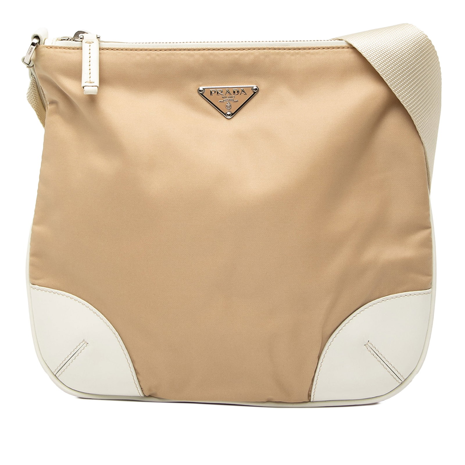 Prada Tessuto Beige Nylon Crossbody Bag with Leather Accents: Prada Tessuto Beige Nylon Crossbody Bag with Leather Accents This Prada Tessuto crossbody bag features a beige nylon body with leather trim, an adjustable flat strap, a top zip closure, and an interio
