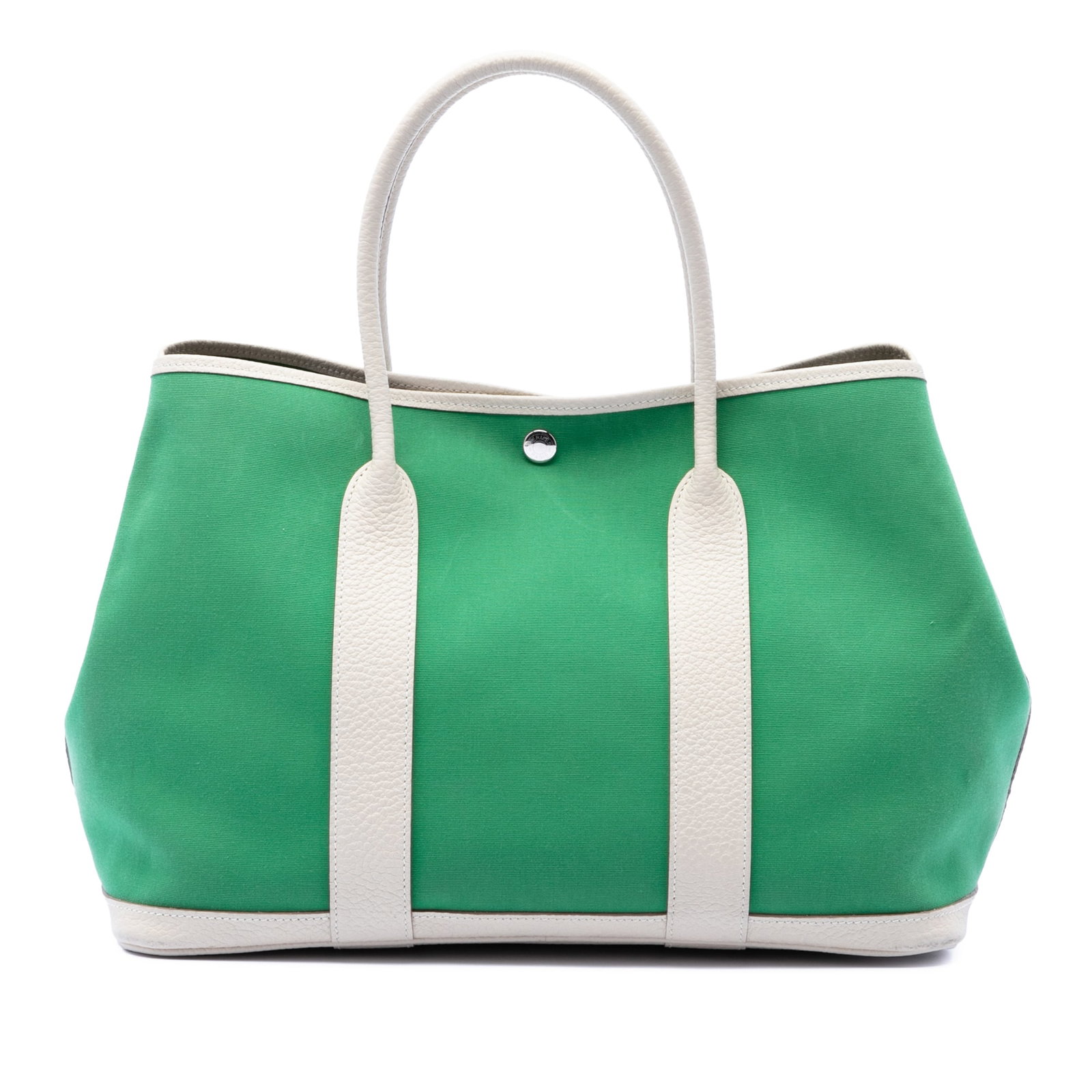 Hermes Garden Party 36 canvas tote with Negonda trim: Hermes Garden Party 36 canvas tote with Negonda trim This Hermes Garden Party 36 bag features a canvas body with Negonda leather trim, rolled leather handles, and an open top with a snap button closur