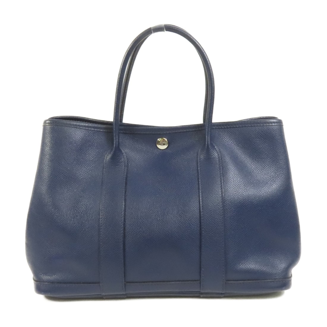 Hermes Garden Party TPM Epsom Calfskin Tote Blue Nuit PHW: Hermes Garden Party TPM Epsom Calfskin Tote Blue Nuit PHW Hermes Garden Party TPM tote bag in Blue Nuit, made from Epsom and calfskin (cowhide). It features a hook button closure, one inside zip pocke