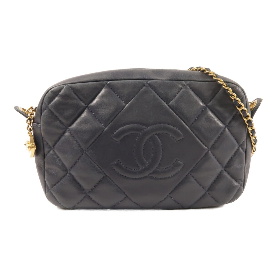 CHANEL CC Camera Shoulder Bag Navy Lambskin with GHW: CHANEL CC Camera Shoulder Bag Navy Lambskin with GHW CHANEL CC camera shoulder bag in navy lambskin leather with gold-tone hardware. This women's shoulder bag includes an interior zip pocket and comes