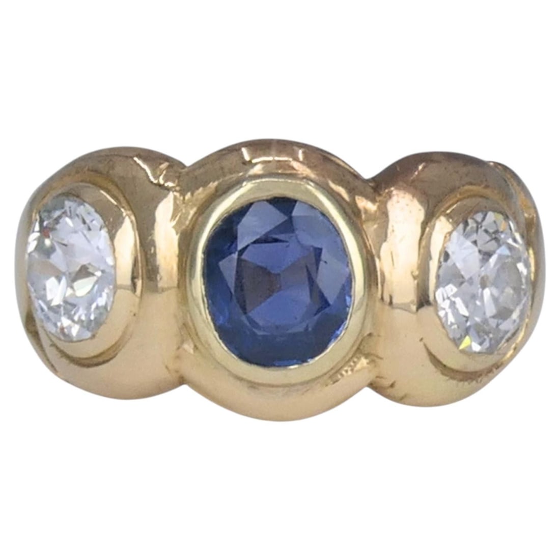 Late Victorian 14k Yellow Gold Sapphire Diamond 3 Stone Ring: Late Victorian 14k Yellow Gold Sapphire Diamond 3 Stone Ring Antique 14k yellow gold three-stone ring featuring a round blue sapphire at the center and two old European cut diamonds. The stones are se