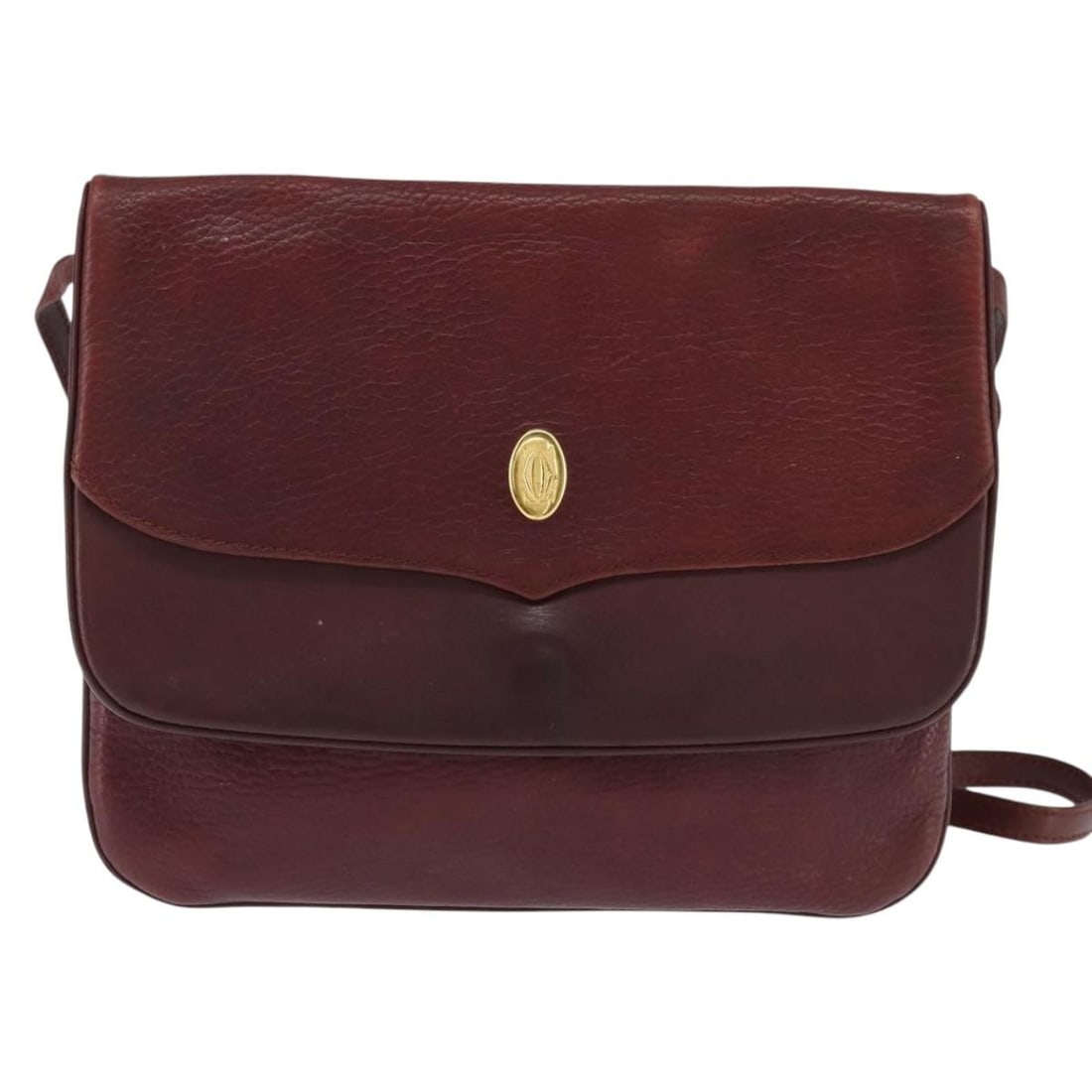 Cartier Must de Cartier Burgundy Leather Shoulder Bag: Cartier Must de Cartier Burgundy Leather Shoulder Bag The Must de Cartier Shoulder Bag is crafted from burgundy leather and designed for women. This pre-owned bag shows noticeable signs of use, includ