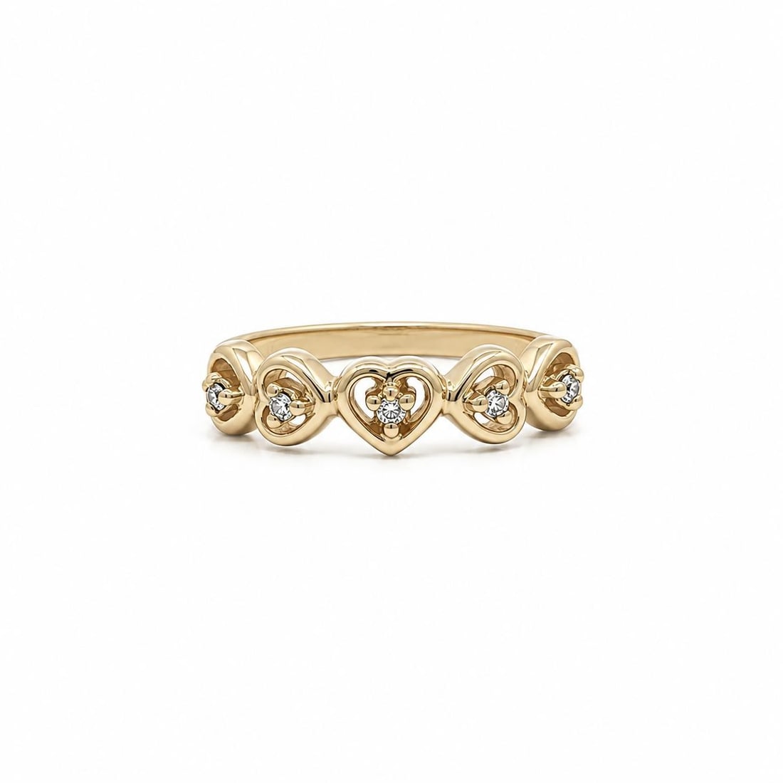 14k Yellow Gold Petite Heart Band Ring with 5 Round Diamonds 0.05ctw: 14k Yellow Gold Petite Heart Band Ring with 5 Round Diamonds 0.05ctw Petite open hearts band ring crafted in solid 14k yellow gold and set with natural round brilliant cut diamonds. This pre-owned wom