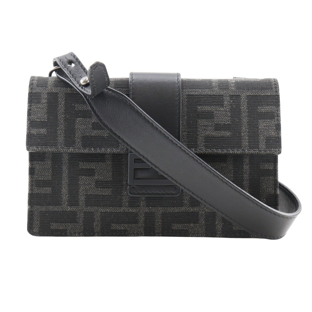 Fendi Baguette Convertible Canvas Belt Bag Black: Fendi Baguette Convertible Canvas Belt Bag Black This Fendi Baguette Convertible Belt Bag is crafted from black Zucca canvas and designed for unisex use. It features a compact size suitable for essent