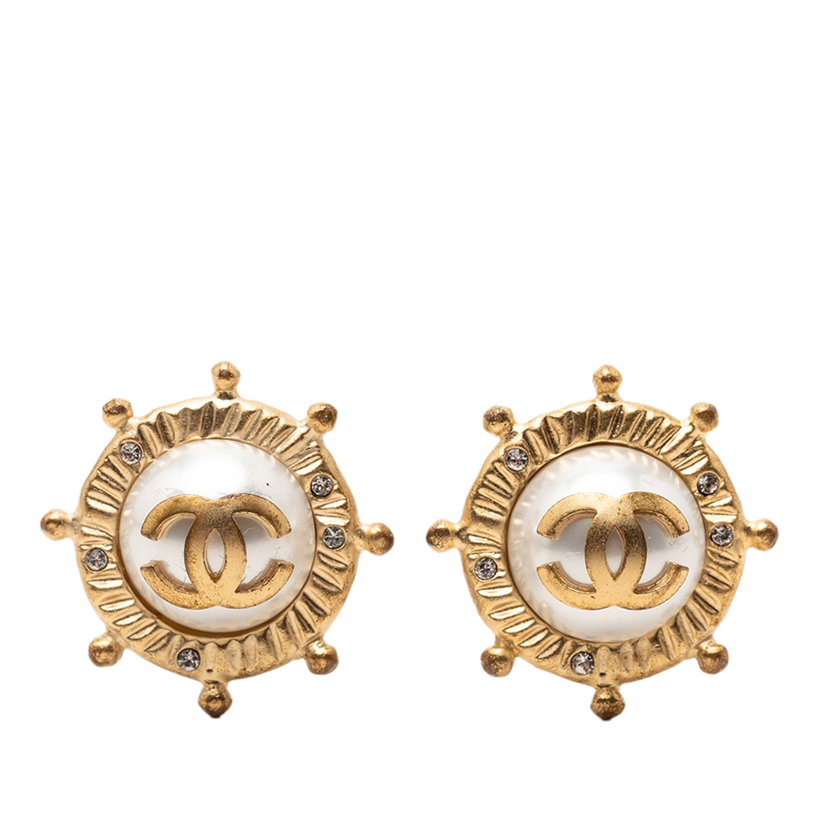 Chanel CC faux pearl strass clip on earrings gold plated: Chanel CC faux pearl strass clip on earrings gold plated These Chanel clip-on earrings showcase the iconic CC logo with gold-tone metal, faux pearl, and strass embellishments. Designed as costume jewe