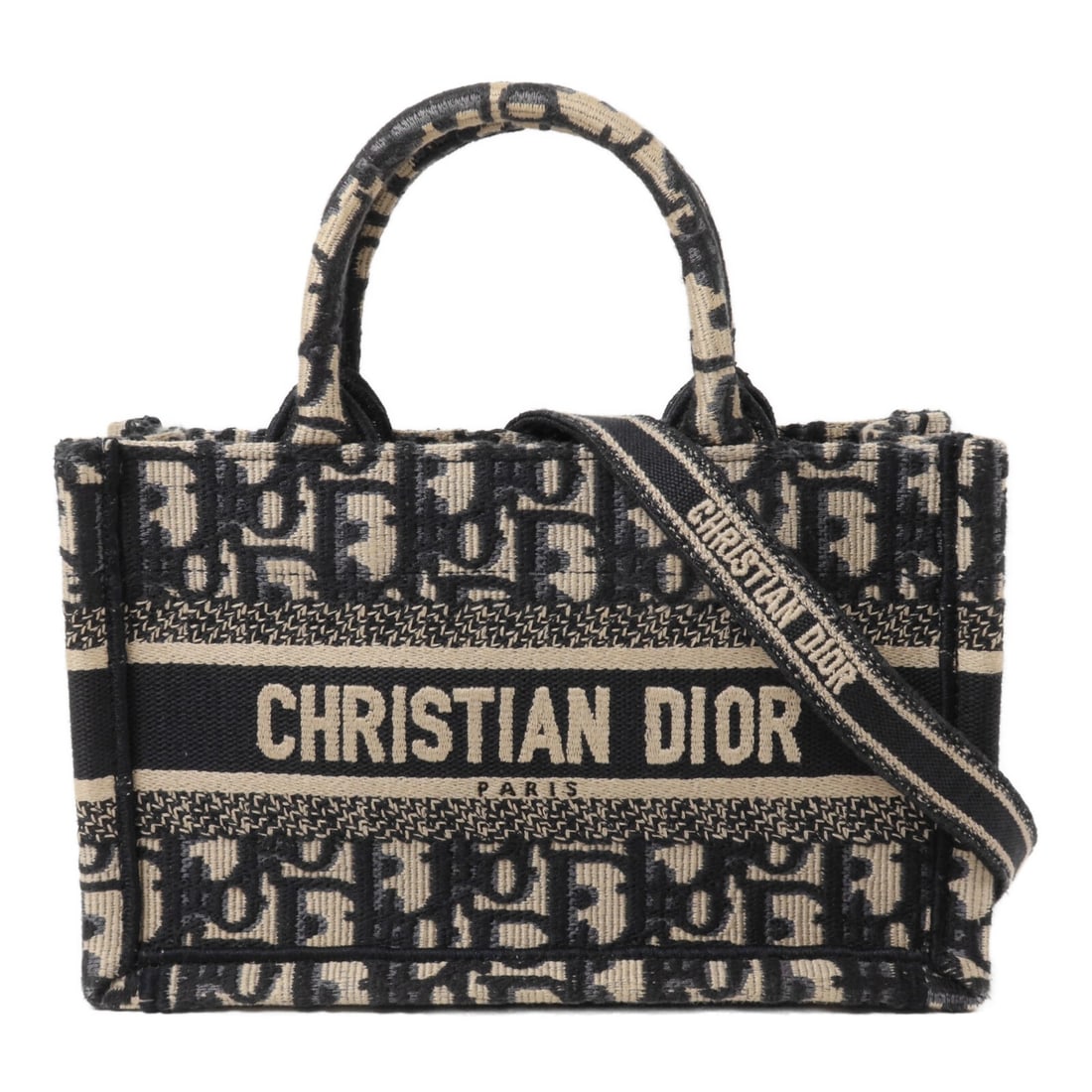 Dior Book Tote Mini 2way Shoulder Bag Navy Canvas: Dior Book Tote Mini 2way Shoulder Bag Navy Canvas Mini Christian Dior Book Tote 2-way shoulder bag in navy canvas. Designed for women, this bag includes top handles and a detachable shoulder strap for