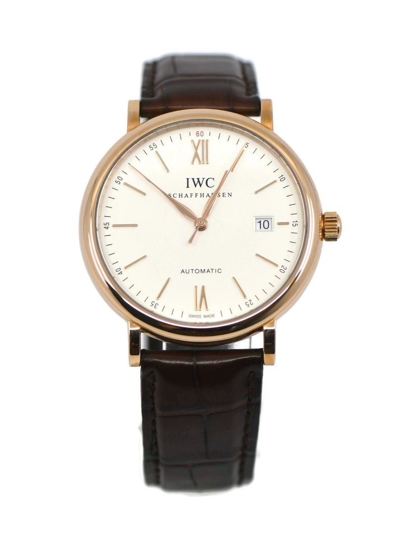 IWC IW356504 Portofino men's 18K rose gold wristwatch with box papers: IWC IW356504 Portofino men's 18K rose gold wristwatch with box papers IWC Portofino men's wristwatch in 18K rose gold with a polished 40 mm round case, silver dial, Roman numeral indices, and a smooth
