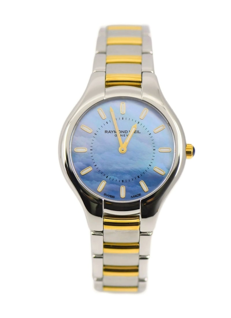 Raymond Weil Noemia womens quartz wristwatch blue dial ref 5132: Raymond Weil Noemia womens quartz wristwatch blue dial ref 5132 Raymond Weil Noemia women's wristwatch with a two tone stainless steel design. It features a blue analog dial, quartz movement, and a st