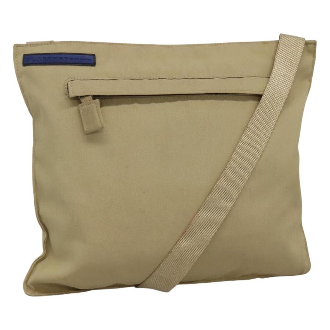 Burberry Blue Label Beige Nylon Shoulder Bag: Burberry Blue Label Beige Nylon Shoulder Bag This Burberry Blue Label shoulder bag features a beige nylon exterior and is designed for unisex use. The bag shows signs of use, including surface rubbing