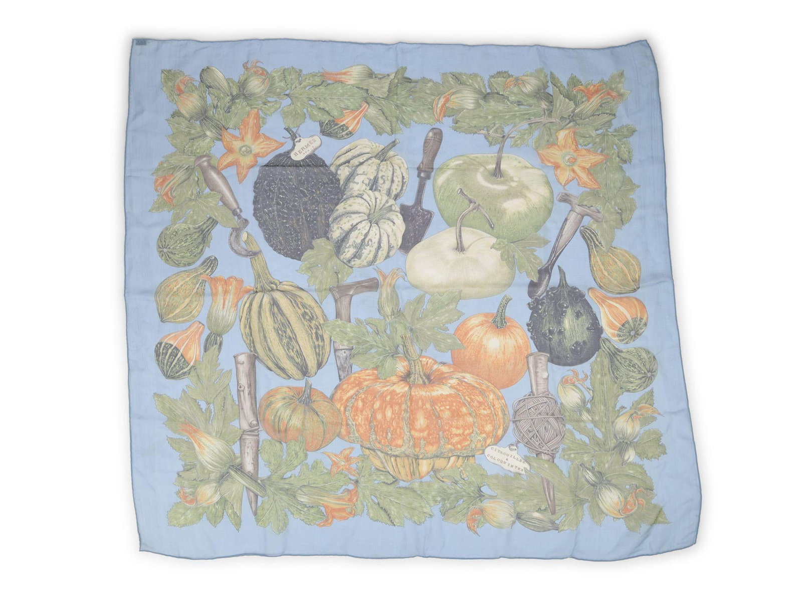 Citrouilles Et Coloquintes Silk Chiffon Scarf by Hermes Blue France: Citrouilles Et Coloquintes Silk Chiffon Scarf by Hermes Blue France This Hermes Citrouilles Et Coloquintes scarf is crafted from 100% silk chiffon and features hand-rolled edges. The design showcases 