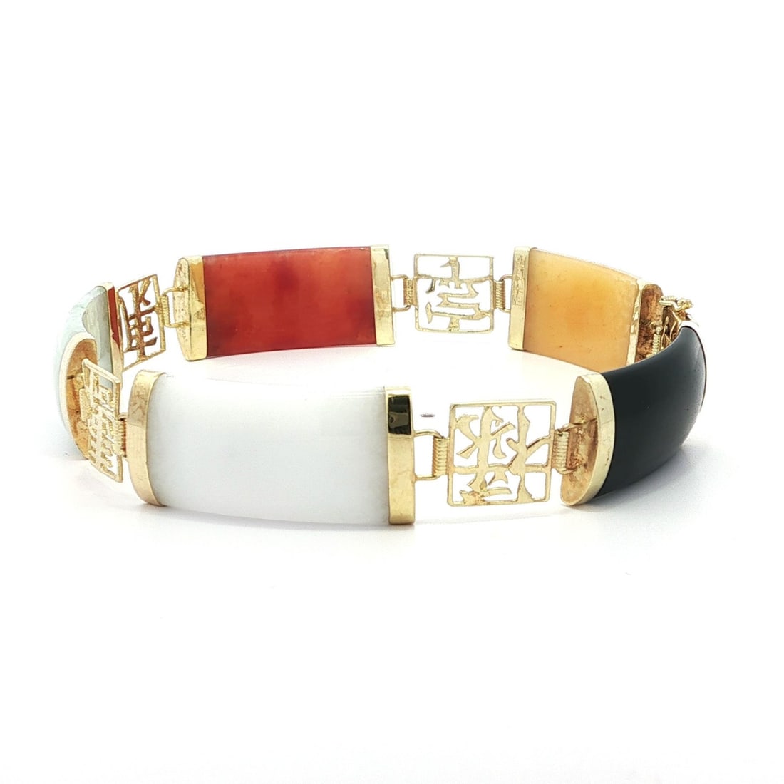 Vintage 14k Yellow Gold Multi Color Jade Chinese Symbol Bracelet: Vintage 14k Yellow Gold Multi Color Jade Chinese Symbol Bracelet This exquisite vintage bracelet showcases a stunning blend of natural jade stones set in solid 14k yellow gold. The piece features five