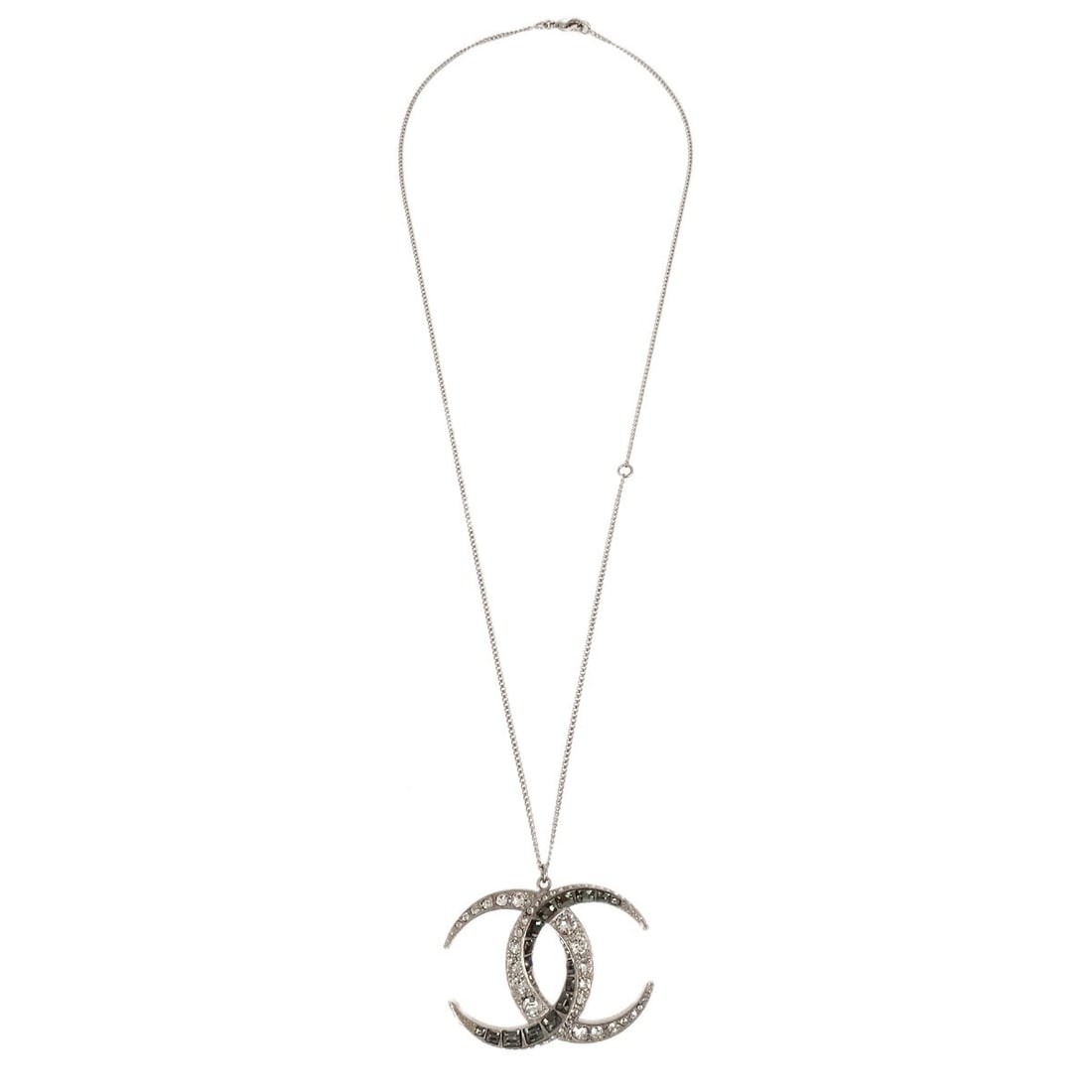 Chanel B16C silver plated chain necklace with rhinestone pendant: Chanel B16C silver plated chain necklace with rhinestone pendant A Chanel silver necklace pendant in a chain style, featuring a silver plated finish and rhinestone embellishment. Made in Italy and pre
