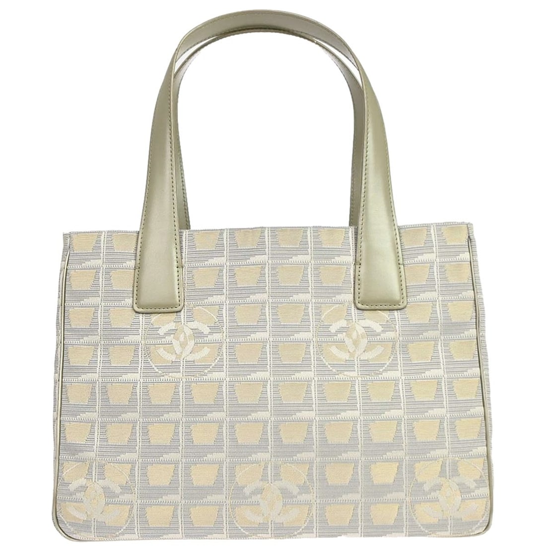 CHANEL Travel Line medium tote in gold jacquard nylon leather: CHANEL Travel Line medium tote in gold jacquard nylon leather Chanel Travel Line tote handbag in gold jacquard nylon with leather trim. This medium women's tote features a casual design with two inter
