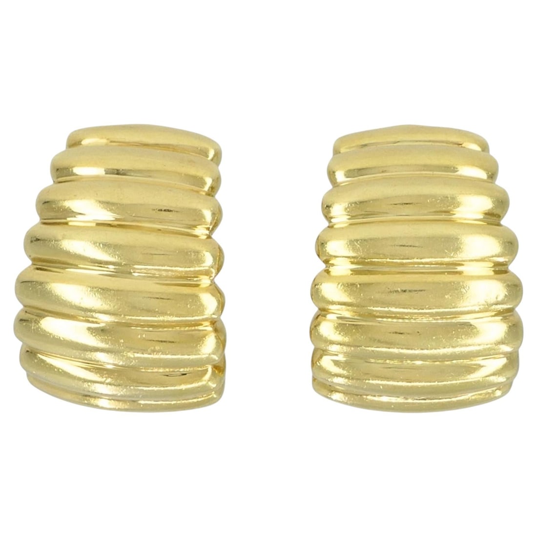 Tiffany & Co. Ribbed Huggie Earrings in 18k Yellow Gold Pair: Tiffany & Co. Ribbed Huggie Earrings in 18k Yellow Gold Pair Vintage 18k yellow gold ribbed huggie earrings in a rounded half hoop form with horizontal ribbed detailing and a polished yellow gold fini