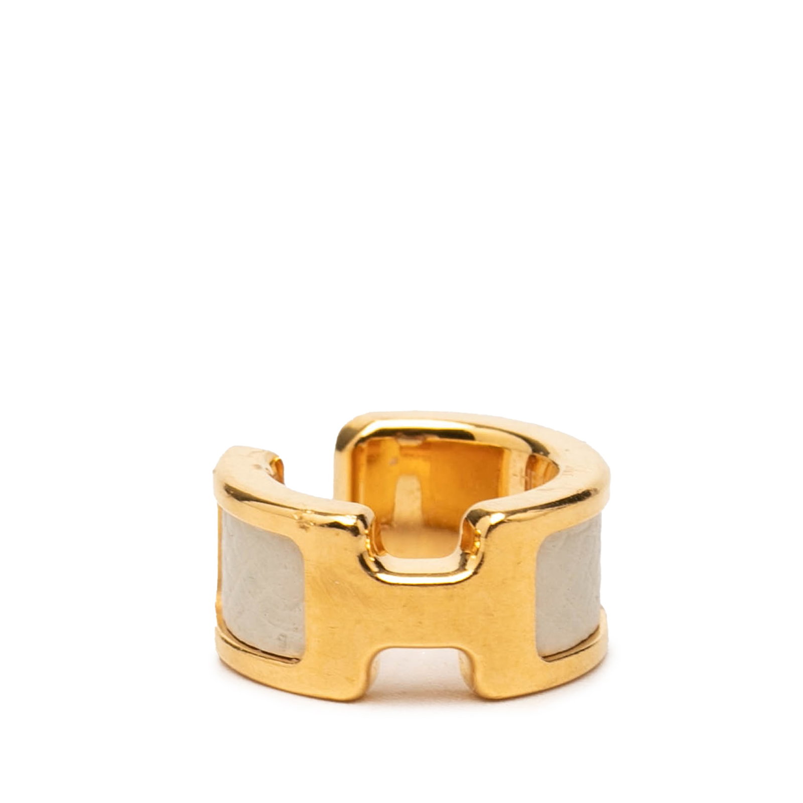 Hermes Olympe Ear Cuff Gold Plated Epsom Leather: Hermes Olympe Ear Cuff Gold Plated Epsom Leather Hermes Olympe ear cuff crafted with a gold plated metal body and Epsom leather detailing. This costume jewelry piece is made in France. Condition is AB