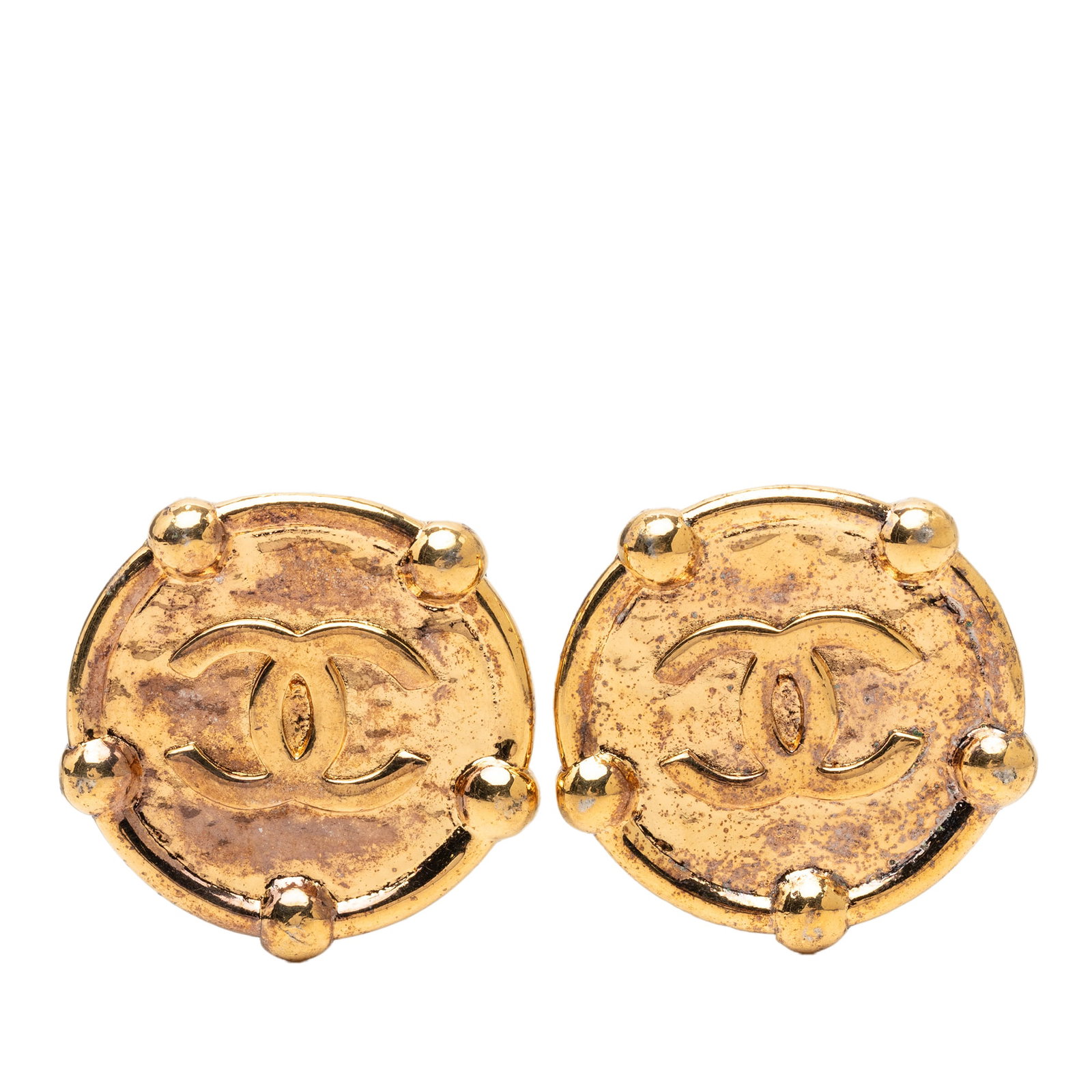 Chanel CC Round Clip Earrings Gold Plated Metal: Chanel CC Round Clip Earrings Gold Plated Metal Round clip-on earrings from Chanel with a gold plated finish and CC motif. This costume jewelry pair is made in France and shows visible wear, including