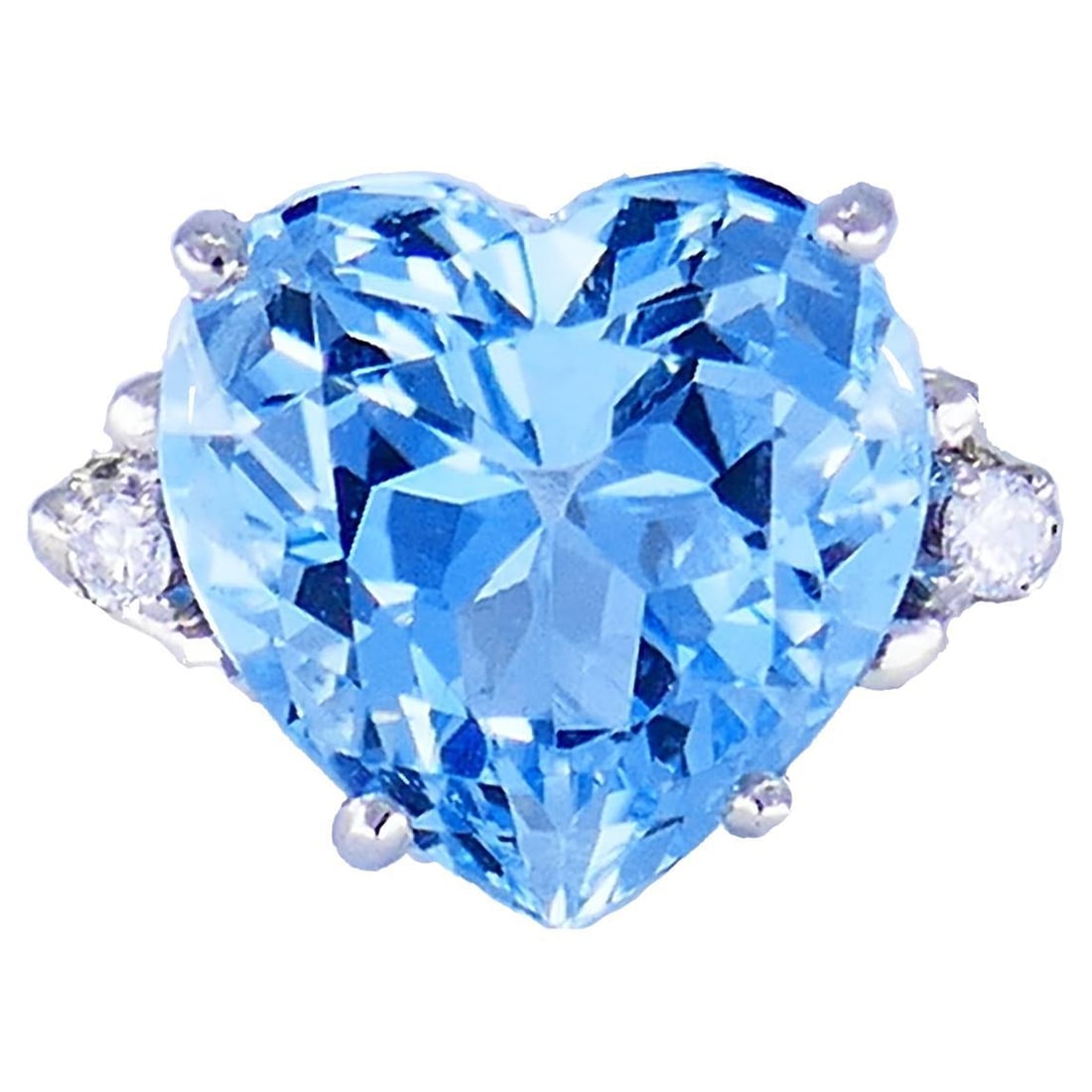 Heart Cut Aquamarine and Diamond Ring in 14k White Gold: Heart Cut Aquamarine and Diamond Ring in 14k White Gold Vintage cocktail ring crafted in 14k white gold, featuring a heart-shaped aquamarine accented by two round brilliant cut diamonds. The ring is s