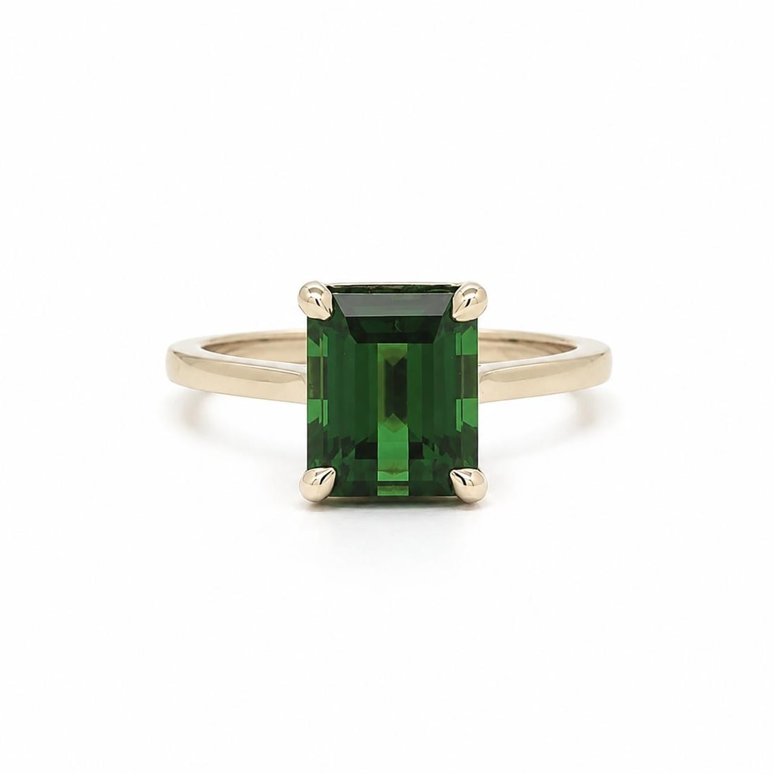 Unbranded 14k Yellow Gold Ring with 4.76ct Green Tourmaline Solitaire: Unbranded 14k Yellow Gold Ring with 4.76ct Green Tourmaline Solitaire Pre-owned women's solitaire ring crafted in solid 14k yellow gold and set with one natural green tourmaline in a rectangular step 