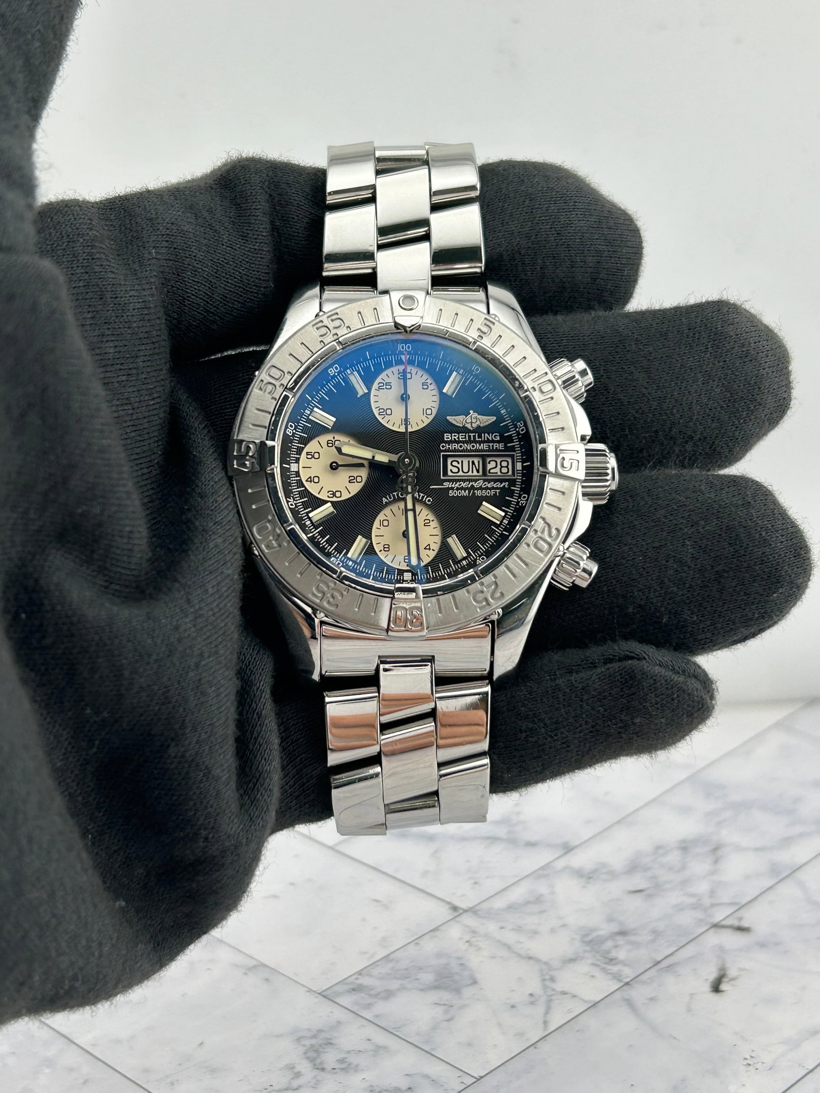 Breitling A13340 Superocean mens watch black dial bracelet papers: Breitling A13340 Superocean mens watch black dial bracelet papers Breitling Superocean men's watch with a black dial and bracelet. This example is reference A13340 and includes papers dated 2009. Spec