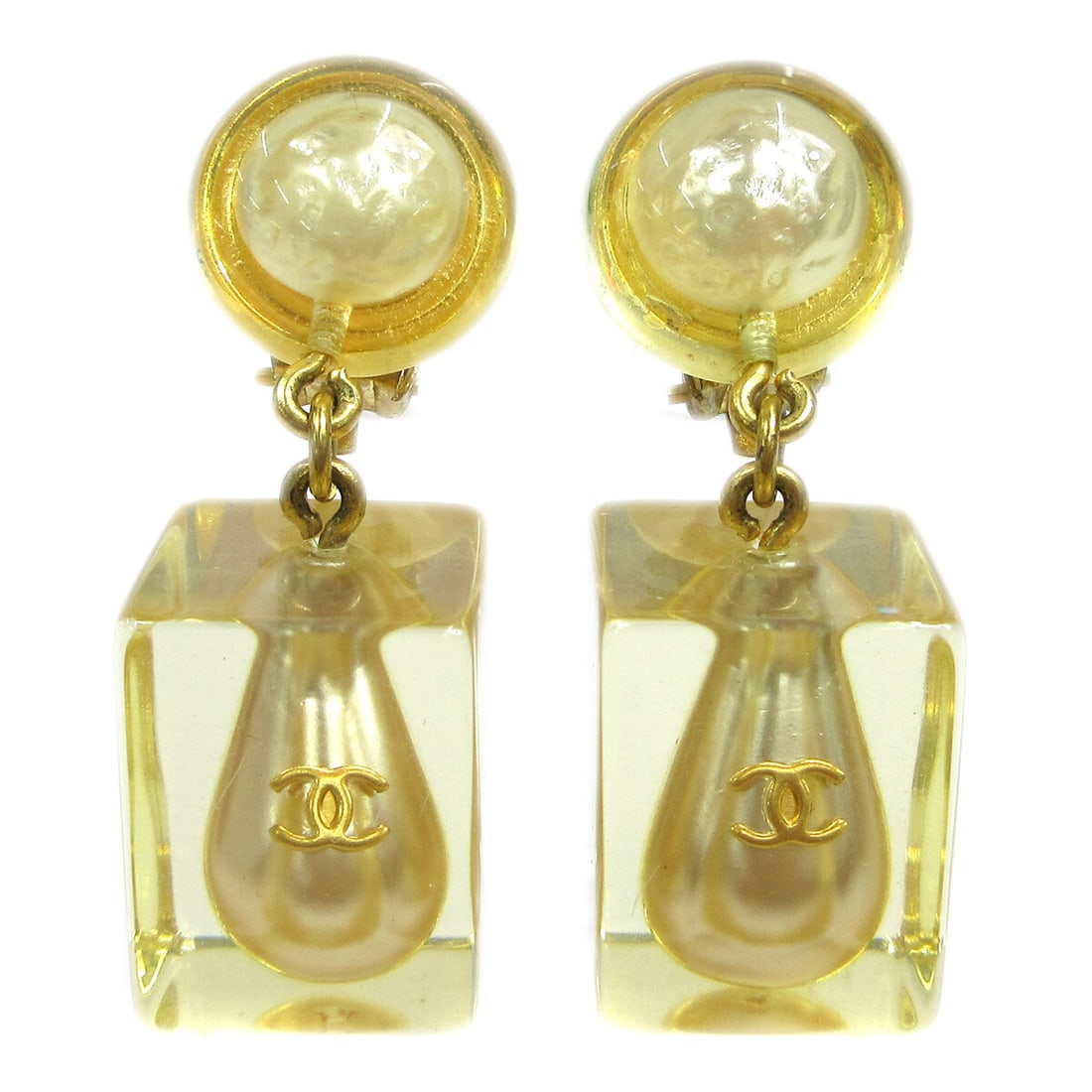 Chanel 97P Clip On Dangle Earrings with Artificial Pearl: Chanel 97P Clip On Dangle Earrings with Artificial Pearl Clip-on dangle earrings featuring artificial pearls, clear plastic elements, and CHANEL CC logo accents. Made in France, this pair is finished 