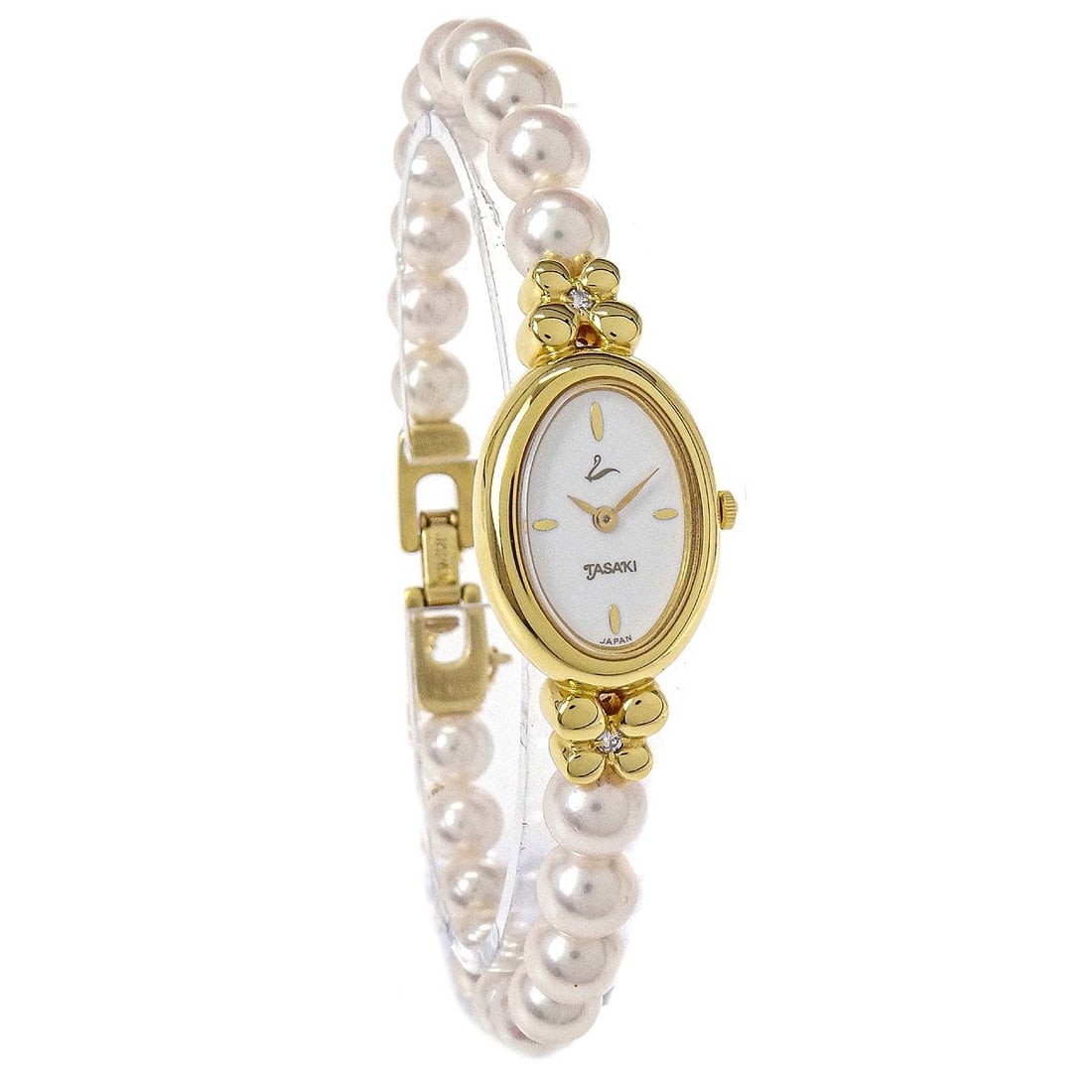 Tasaki Pearl Wristwatch Gold Plated Quartz Diamond 22 mm: Tasaki Pearl Wristwatch Gold Plated Quartz Diamond 22 mm Tasaki women's wristwatch with a quartz movement and analog display. It features a gold plated case, a pearl band in gold and white, and a whit