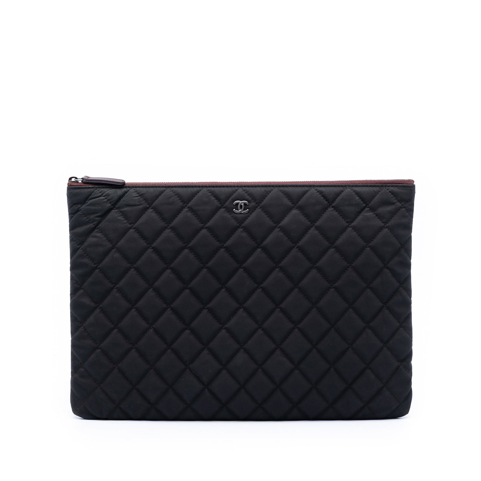 Chanel O Case Large Quilted Nylon Zip Clutch Bag: Chanel O Case Large Quilted Nylon Zip Clutch Bag Large Chanel O Case clutch in quilted nylon with a top zip closure. This black clutch is made in Italy. Condition AB with visible wear and use, includi