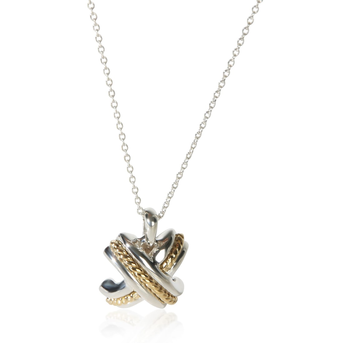 Tiffany Co Signature X Pendant in 18k Gold and Sterling Silver: Tiffany Co Signature X Pendant in 18k Gold and Sterling Silver Pre-owned Tiffany & Co. Signature X pendant from the Signature X collection. This women's pendant is crafted in yellow gold and sterling 