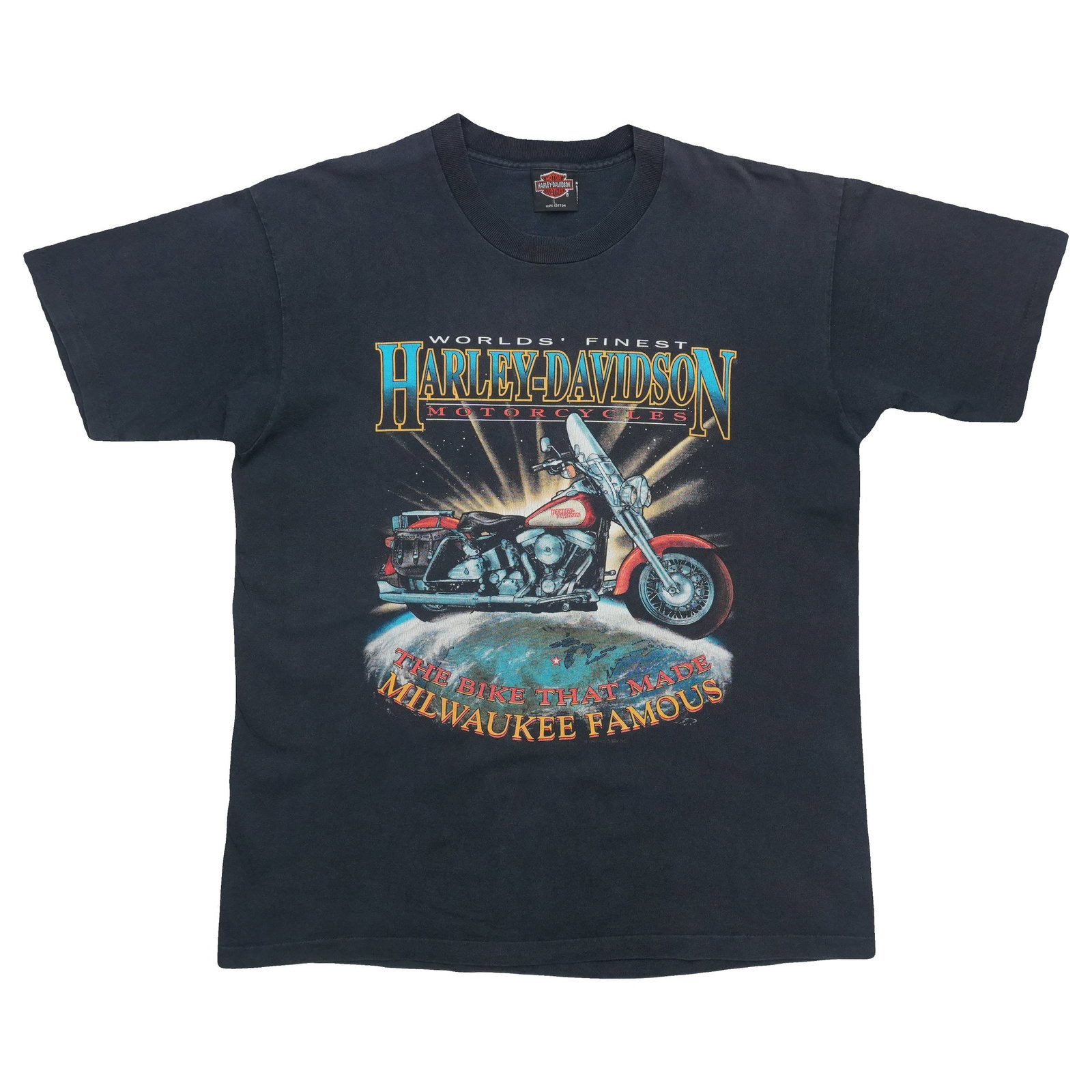 Black 1992 Harley Davidson World Famous vintage cotton shirt: Black 1992 Harley Davidson World Famous vintage cotton shirt Authentic vintage 1992 Harley Davidson World Famous shirt from the 1990s. This original single-stitch tee features front and back graphics 