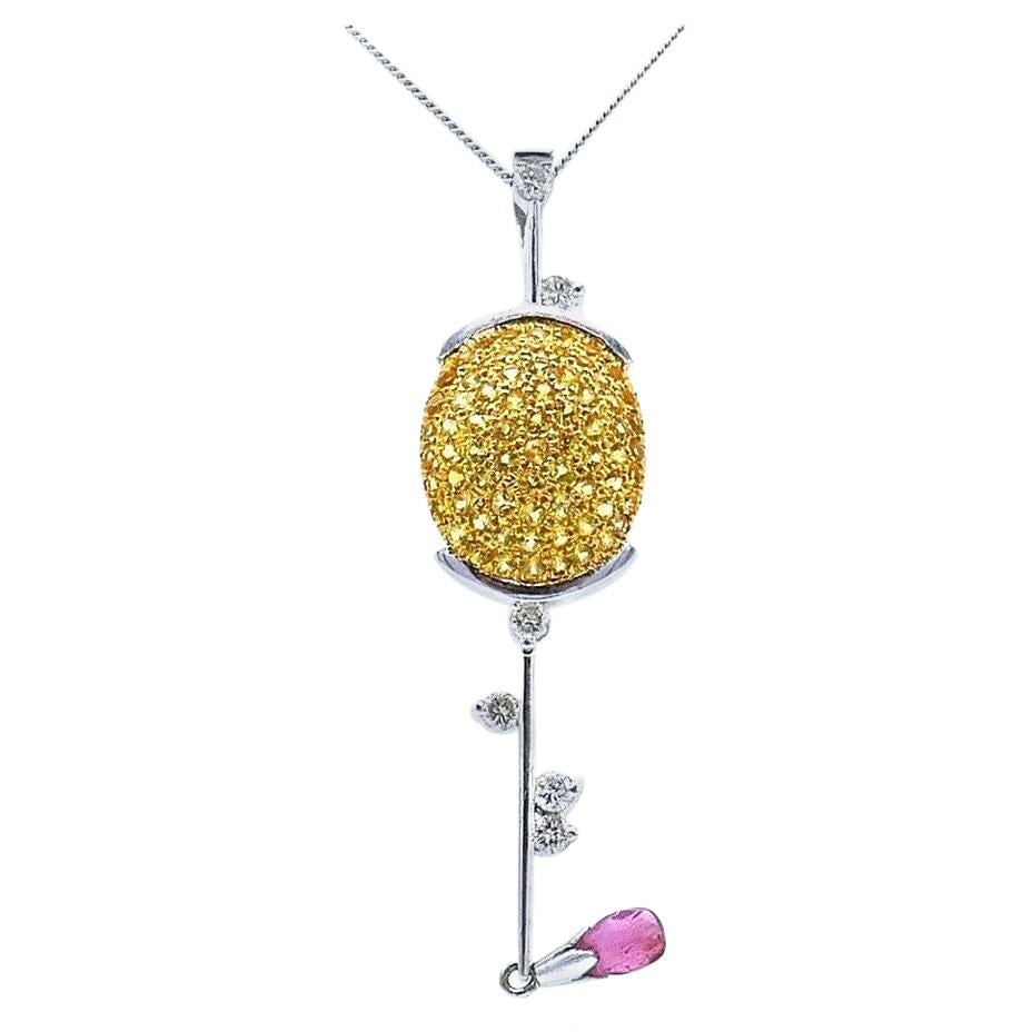 1980 Golf Club Pendant Necklace in Platinum 14k Gold with Diamonds: 1980 Golf Club Pendant Necklace in Platinum 14k Gold with Diamonds Vintage pendant necklace featuring a stylized golf club design in platinum and yellow gold, accented with yellow sapphires, diamonds,