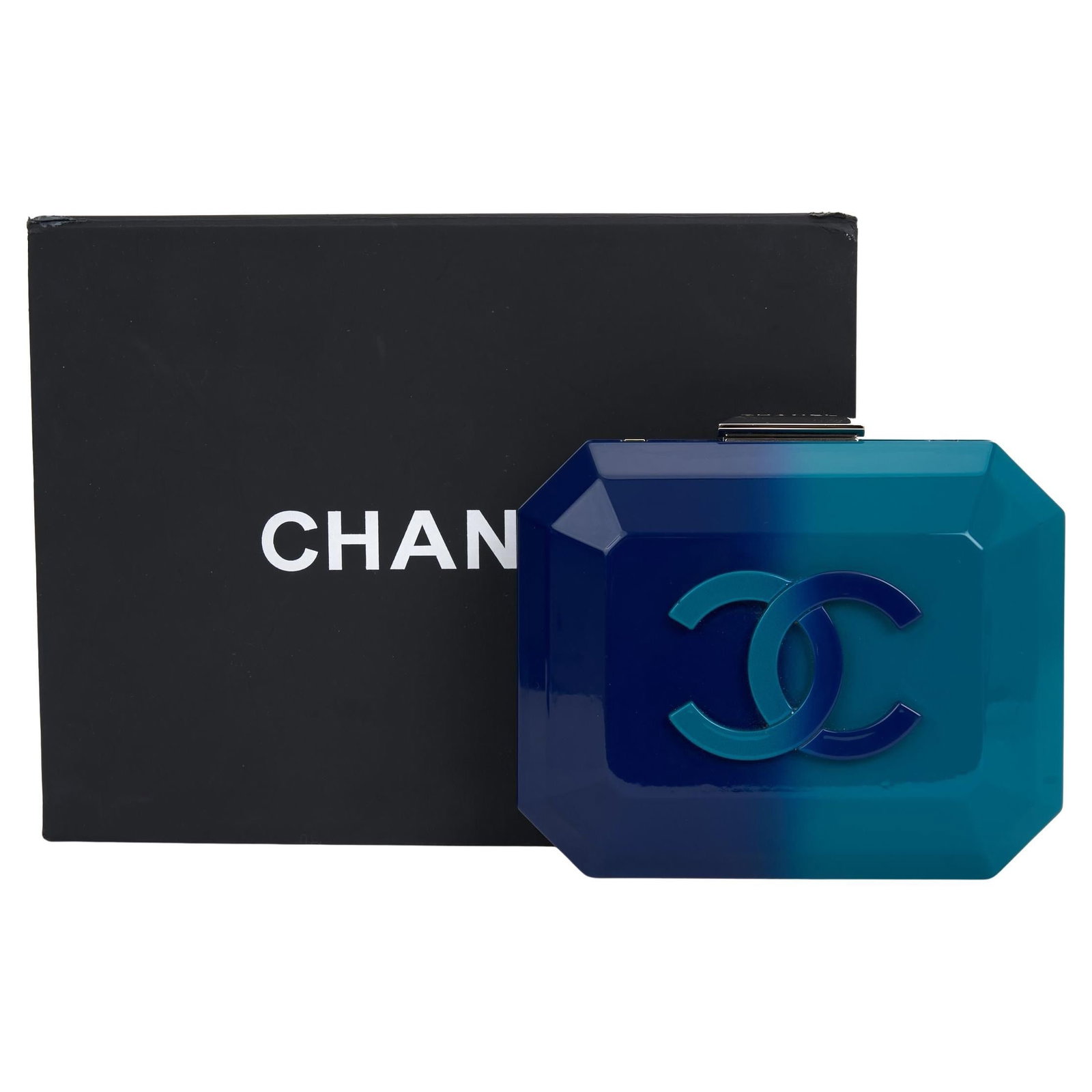 Chanel Ombre Plexiglass Clutch 2014 with Chain and Accessories: Chanel Ombre Plexiglass Clutch 2014 with Chain and Accessories Introducing the Chanel Ombre Plexiglass Clutch on Chain, a stunning accessory that seamlessly blends luxury with functionality. Crafted f