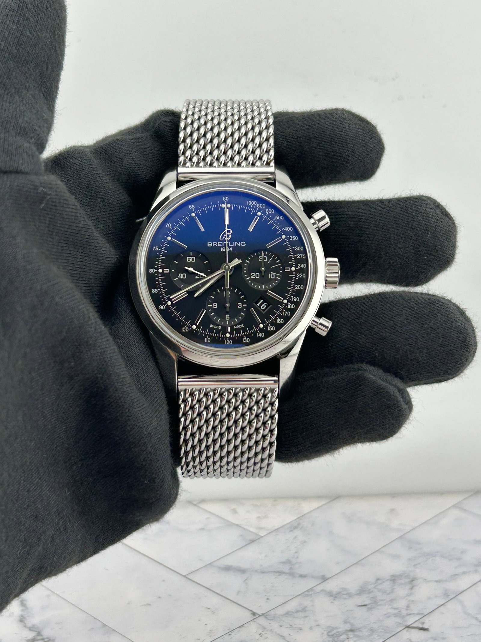 Breitling AB0152 Transocean mens watch black dial woven steel bracelet: Breitling AB0152 Transocean mens watch black dial woven steel bracelet Breitling Transocean men's watch with a black dial and woven steel bracelet. This piece is identified by reference AB0152 and inc