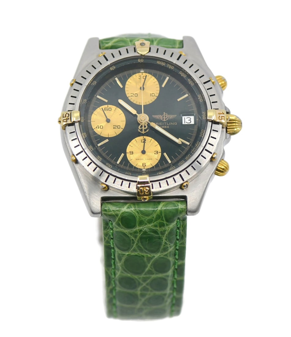 Breitling Chronomat 18K Steel Automatic Green Leather Watch B13047: Breitling Chronomat 18K Steel Automatic Green Leather Watch B13047 This Breitling Chronomat wristwatch features a two-tone design with a stainless steel and 18K gold case, complemented by a green leat