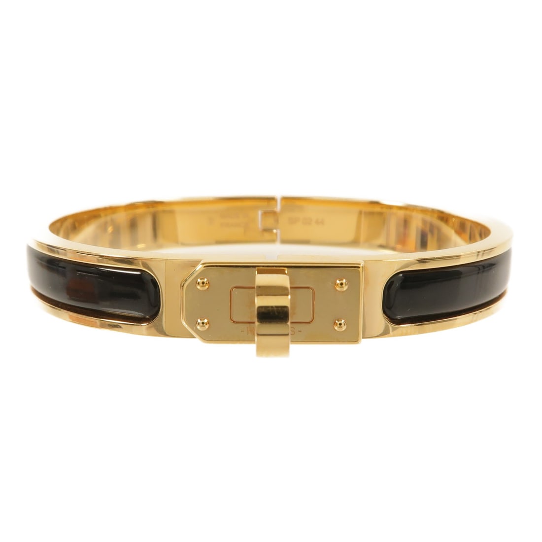 Hermes Mini Clic Kelly Bracelet Black Enamel Gold Tone Metal: Hermes Mini Clic Kelly Bracelet Black Enamel Gold Tone Metal HERMES GHW Mini Clic Kelly Bracelet in metal and enamel with a gold and black colorway. The bracelet is sized at 10 mm in width, with a mot