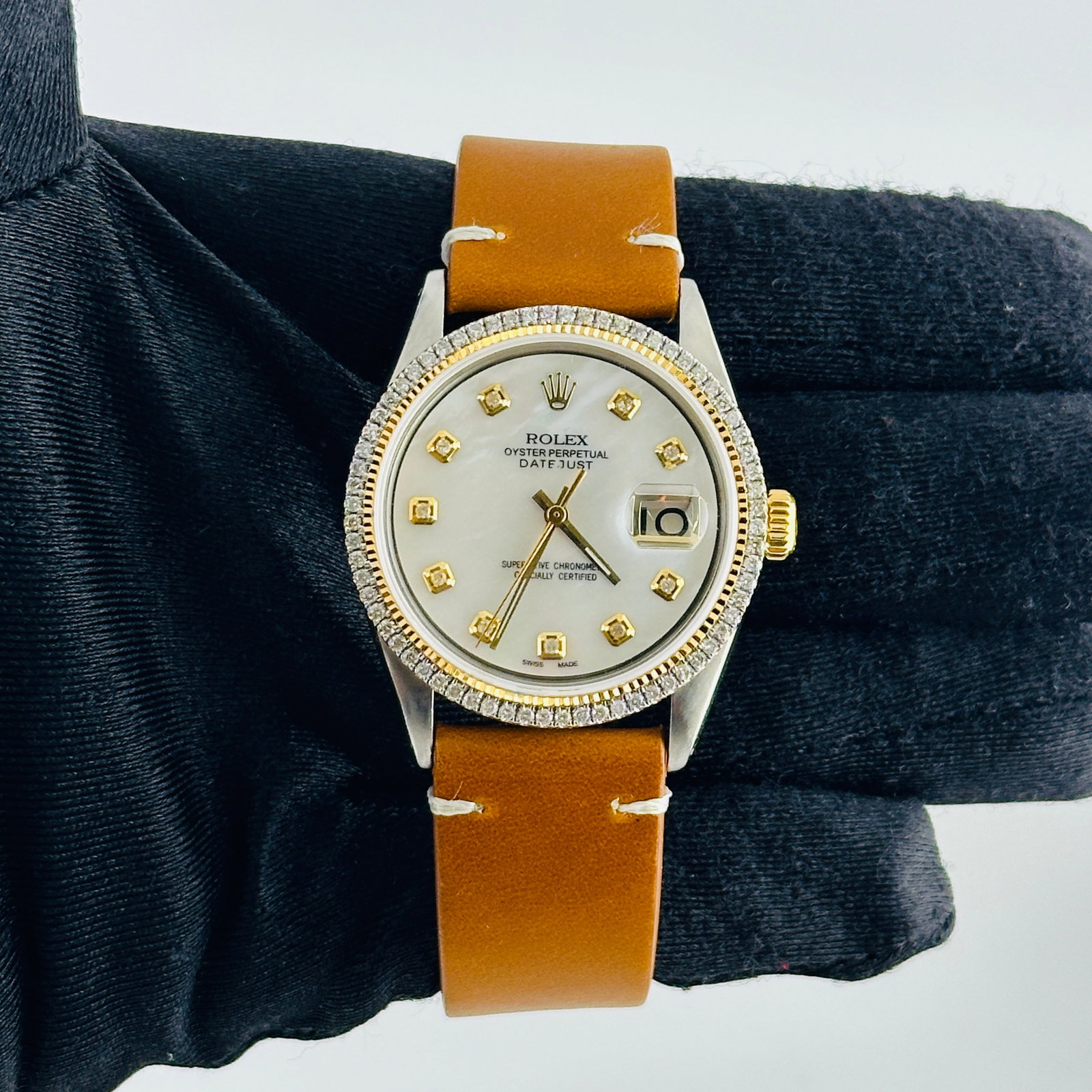 Rolex Datejust Ref 1601 Mens Aftermarket White MOP Dial Aftermarket Leather Band Yellow Diamond: Rolex Datejust Ref 1601 Mens Aftermarket White MOP Dial Aftermarket Leather Band Yellow Diamond Markers This Rolex Datejust features an aftermarket white mother-of-pearl dial with yellow diamond marke