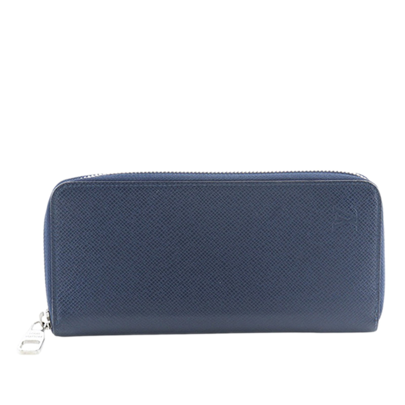 Louis Vuitton Taiga Blue Zip Around Long Wallet: Louis Vuitton Taiga Blue Zip Around Long Wallet This Louis Vuitton Taiga Zippy Vertical Long Wallet is crafted from blue Taiga leather and features a zip-around closure. The interior is designed with 