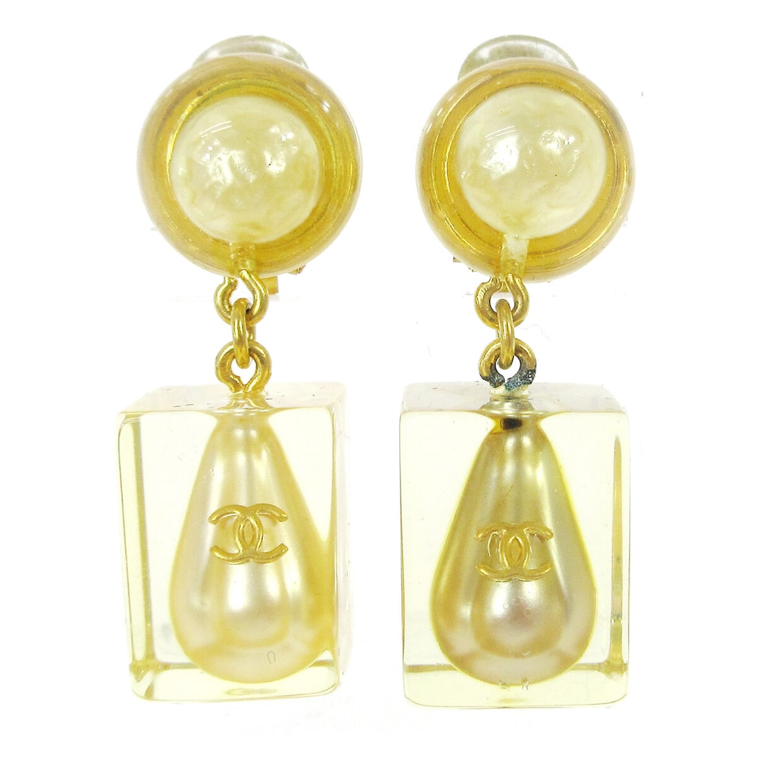 Chanel 97P Clip On Dangle Earrings with Faux Pearl CC: Chanel 97P Clip On Dangle Earrings with Faux Pearl CC Clip-on dangle earrings featuring Chanel CC logos with artificial pearl accents and clear acrylic elements. Made in France, this pair comes with a