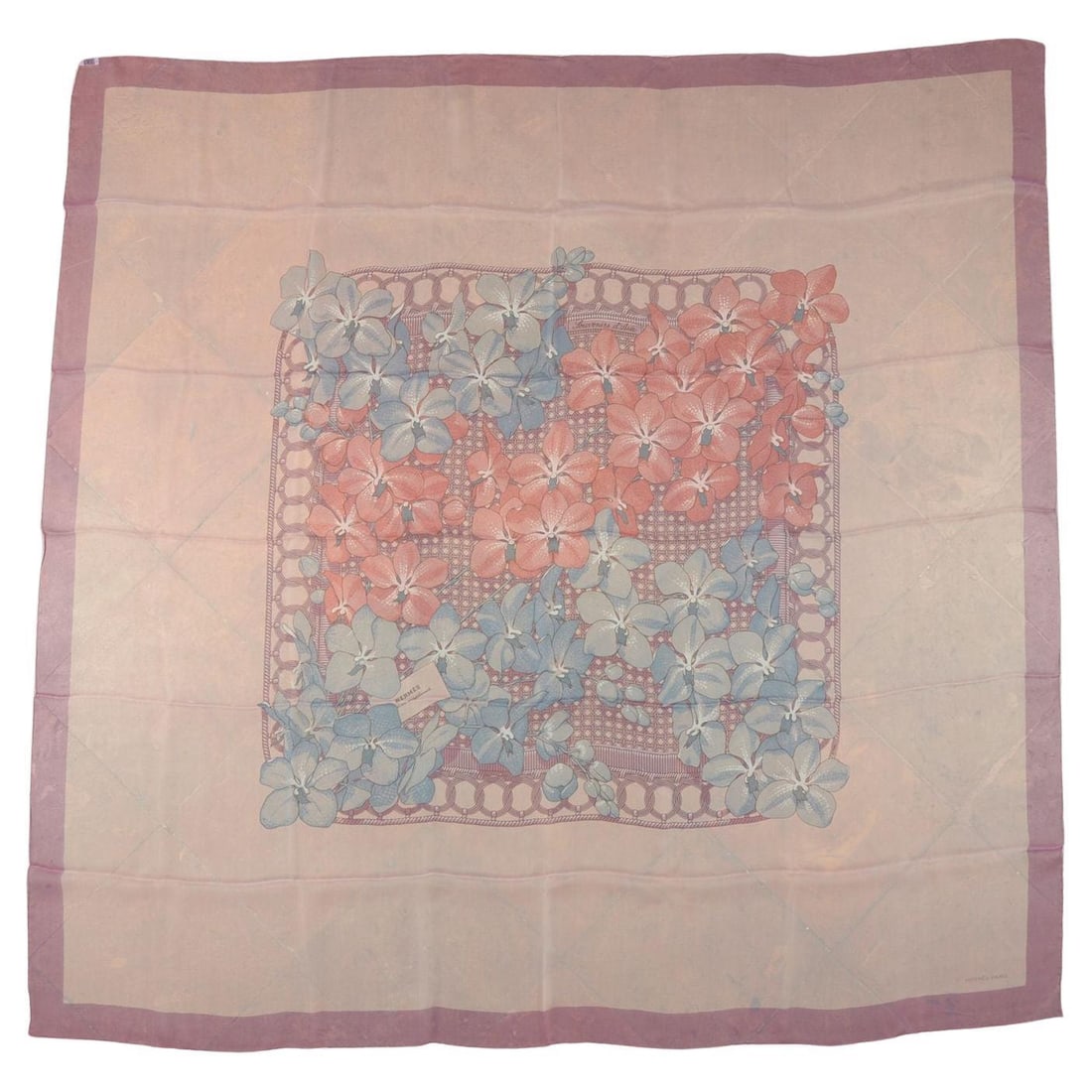 Hermes Floral Print Silk Chiffon Shawl 52 in: Hermes Floral Print Silk Chiffon Shawl 52 in This Hermes shawl features a delicate floral print in light blue and pink tones, crafted from 100% silk chiffon. The design is highlighted by hand-rolled e
