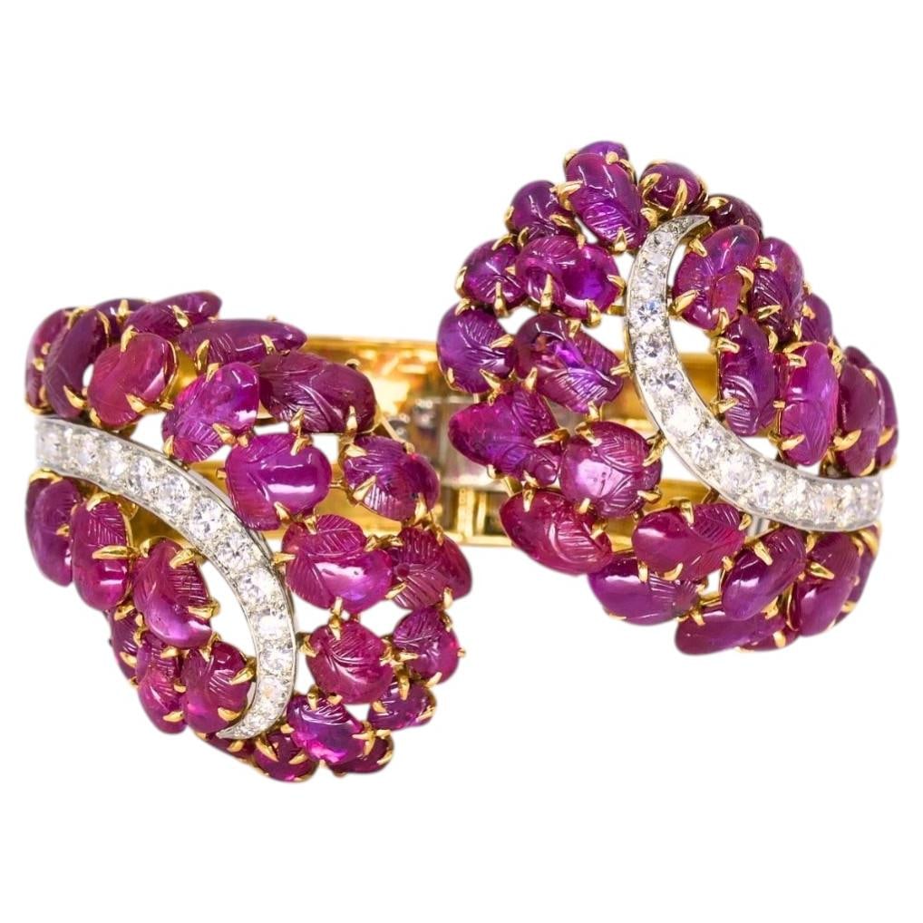 Boucheron 18k Gold Platinum Ruby Diamond Bracelet GIA French: Boucheron 18k Gold Platinum Ruby Diamond Bracelet GIA French Vintage Boucheron bracelet crafted in 18k yellow gold and platinum, featuring carved cabochon rubies and diamond accents. The rubies are re