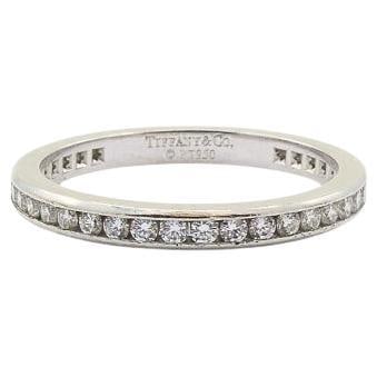 Platinum Diamond Wedding Band Ring Tiffany and Co Size 6: Platinum Diamond Wedding Band Ring Tiffany and Co Size 6 A classic Tiffany & Co. wedding band in platinum with diamond accents. The ring features a row of round brilliant-cut diamonds channel set into