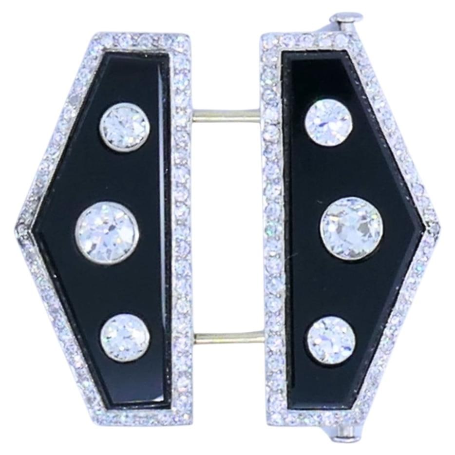 Charlton & Co. Art Deco double clip brooch in platinum with diamonds and onyx: Charlton & Co. Art Deco double clip brooch in platinum with diamonds and onyx Art Deco double clip brooch by Charlton & Co., crafted in platinum with polished black onyx panels and Old European cut di