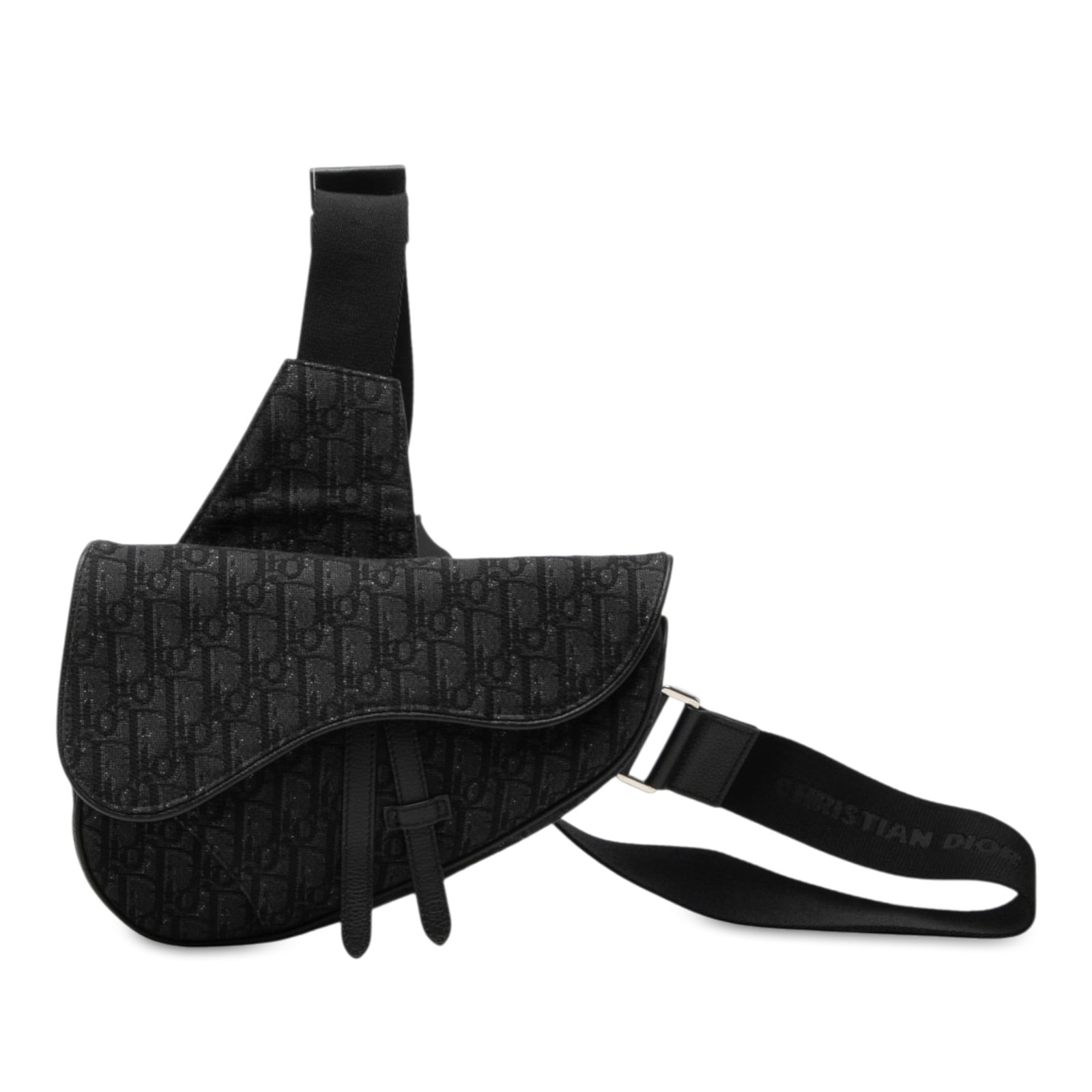 Dior Saddle Crossbody Bag in Black Oblique Canvas: Dior Saddle Crossbody Bag in Black Oblique Canvas Dior Oblique Canvas Saddle Crossbody bag with a canvas body, adjustable flat shoulder strap, flap with magnetic snap closure, and top zip closure. Mad