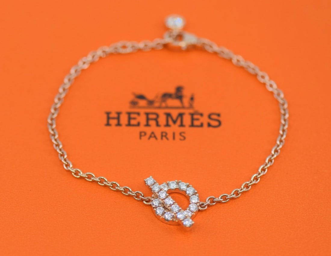 HERMES Finesse 18K Rose Gold Diamond Bracelet Authentic with Box: HERMES Finesse 18K Rose Gold Diamond Bracelet Authentic with Box This exquisite bracelet showcases a stunning design crafted from 18K rose gold. It features a chain style adorned with sparkling diamon