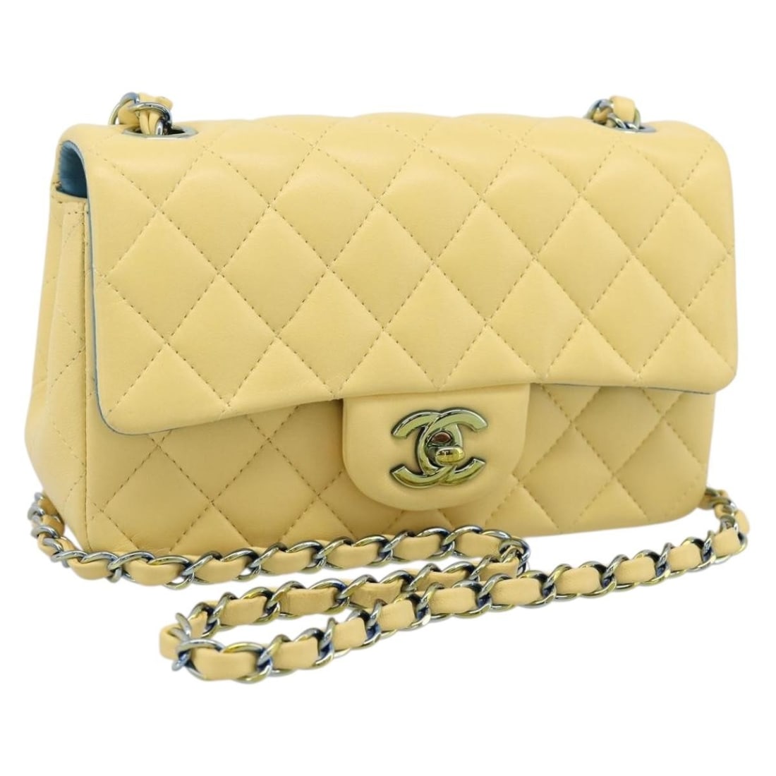 CHANEL Mini Matelasse Lamb Skin Shoulder Bag Yellow CC Chain: CHANEL Mini Matelasse Lamb Skin Shoulder Bag Yellow CC Chain Compact and elegant shoulder bag crafted from yellow lamb skin with CHANEL's Mini Matelasse 20 design. Made in France, this women's bag inc