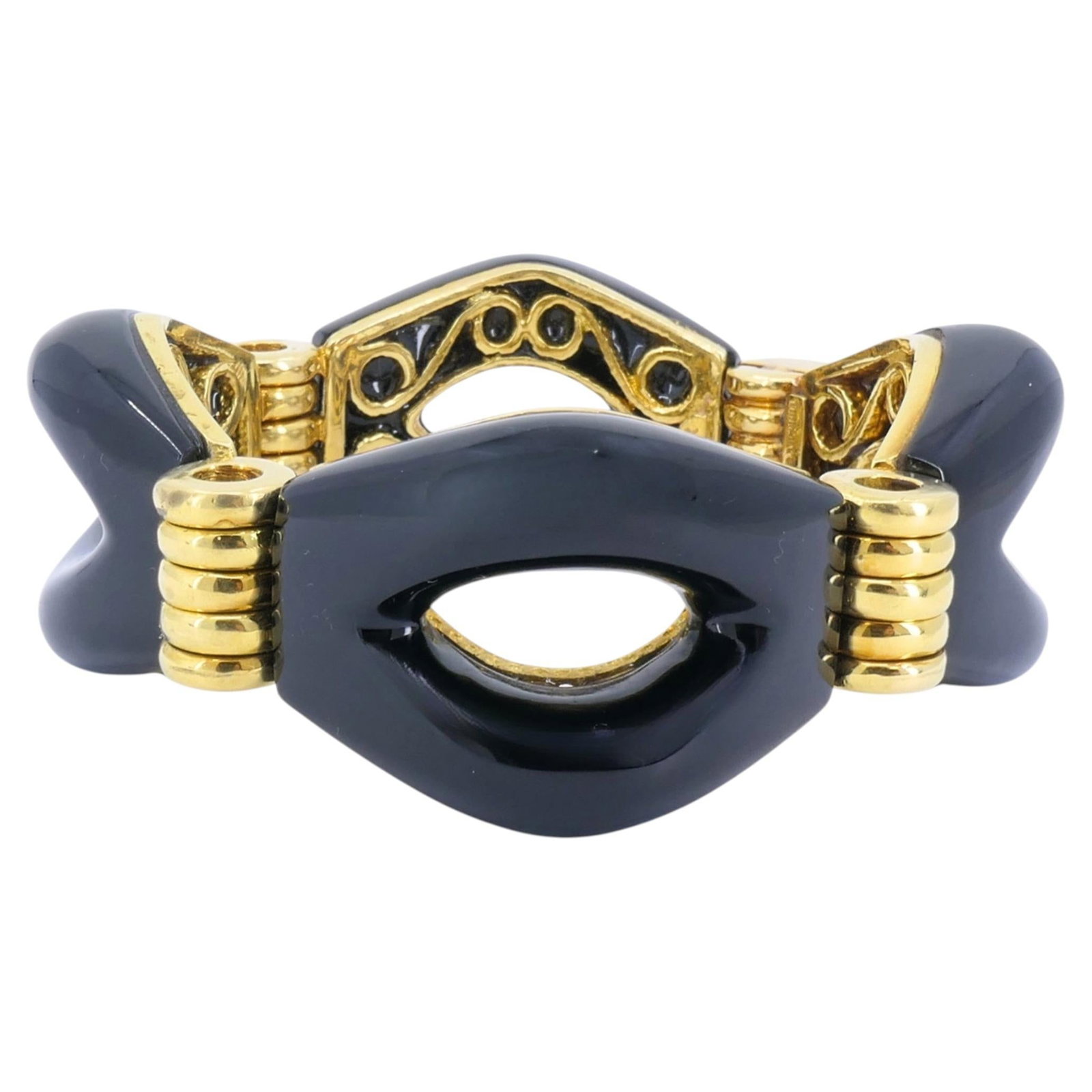 Tiffany Co 18k Gold Cuff Bracelet with Black Onyx: Tiffany Co 18k Gold Cuff Bracelet with Black Onyx Bold 1970s cuff bracelet in 18k gold with black onyx panels and a mixed-cut stone presentation. The design features a sculptural openwork center, smoo