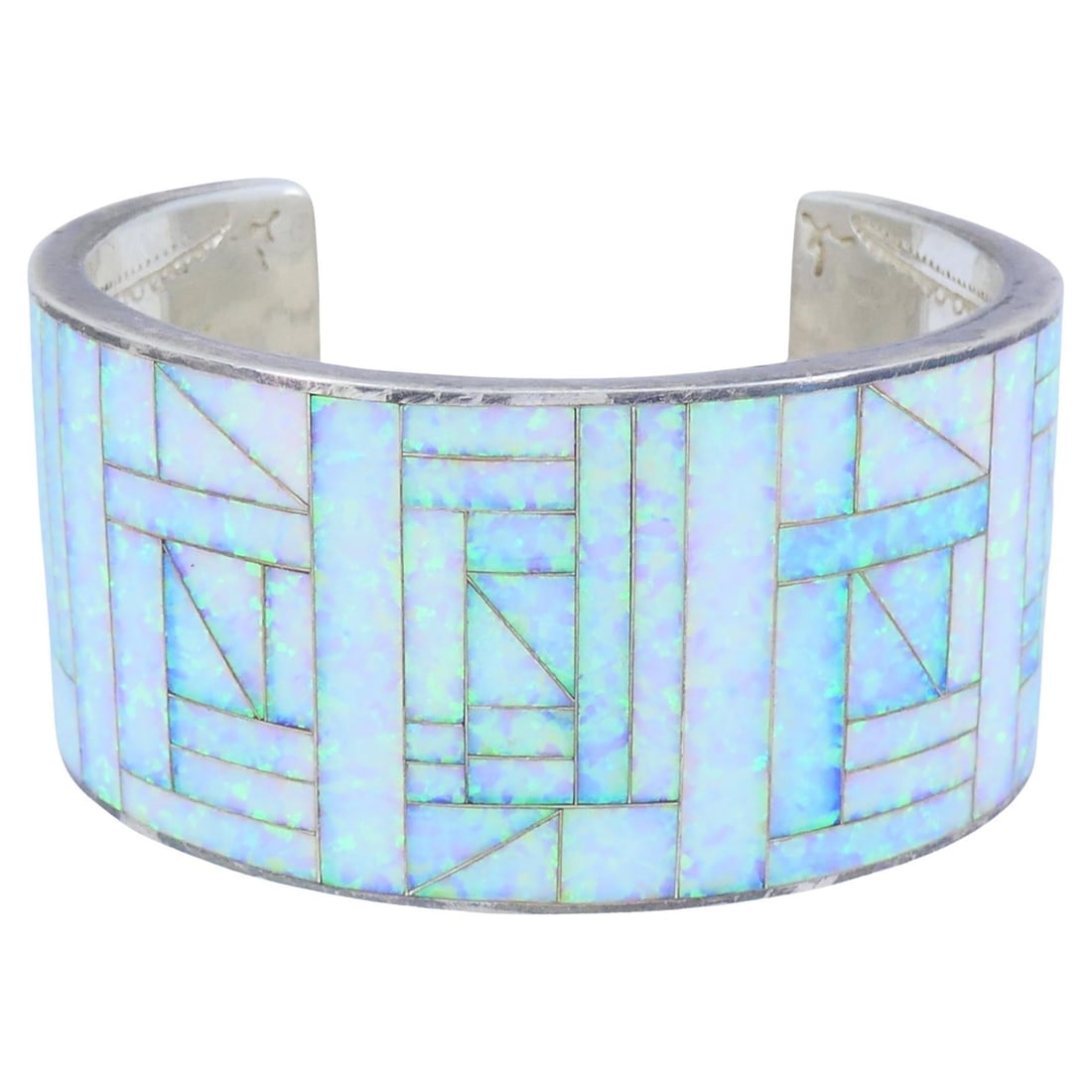 Signed JLS Sterling Silver Cuff Bracelet with Opal Inlay: Signed JLS Sterling Silver Cuff Bracelet with Opal Inlay Vintage sterling silver opal inlay cuff bracelet signed JLS, dating to the 1970s. It features a wide geometric mosaic design with multiple pane